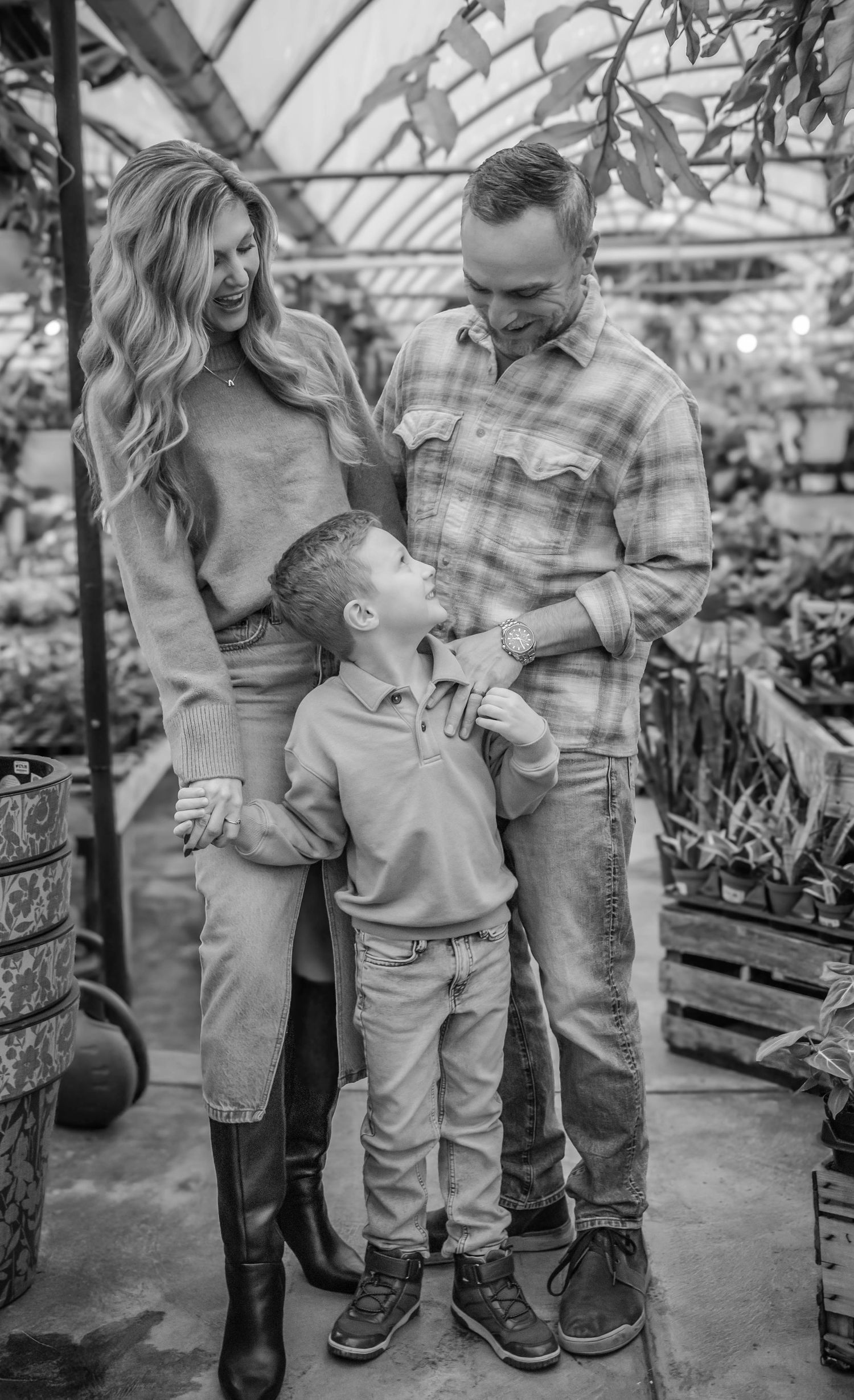 Black and white family photography session at a garden center.