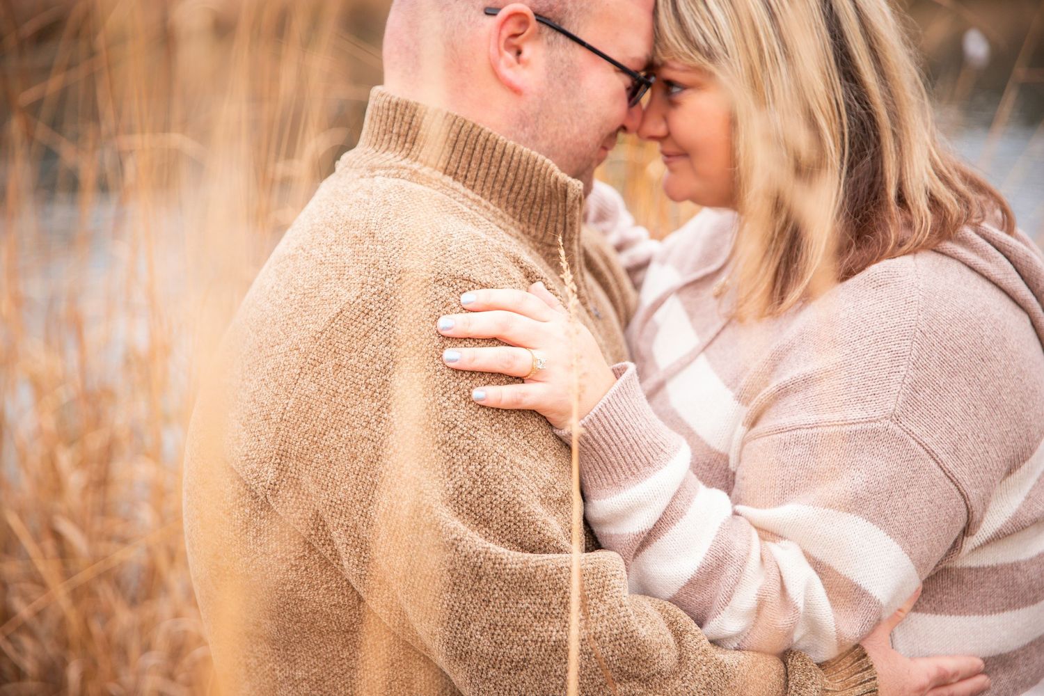 Romantic couple shares tender moments in a series of warm-toned outdoor photos during golden hour.