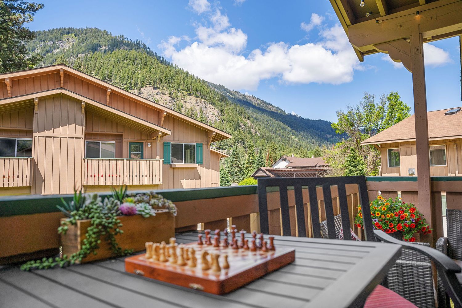 Mountain view balcony with wooden railings at Alpine Village condominiums.