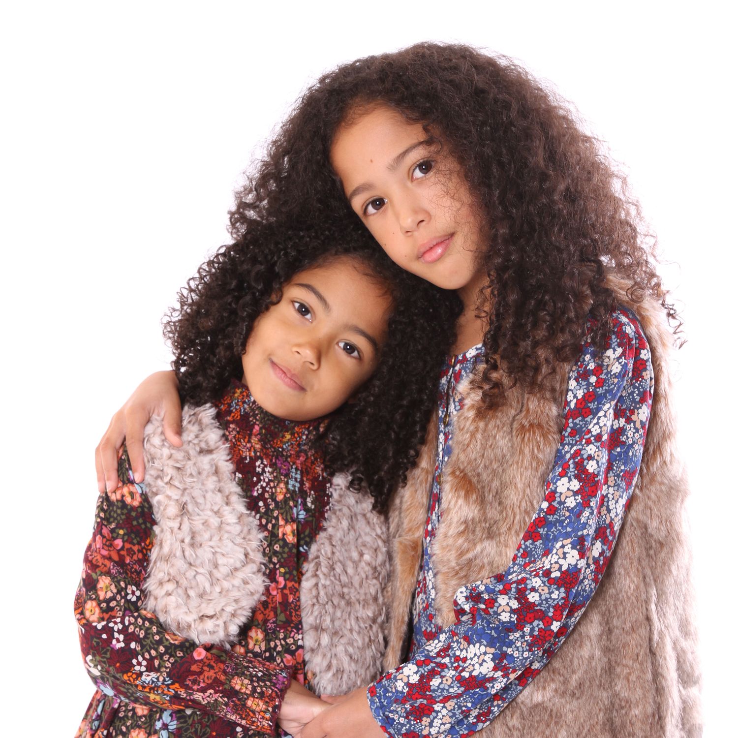 A sequence of five photos showing playful expressions and poses with curly hair and a floral dress.