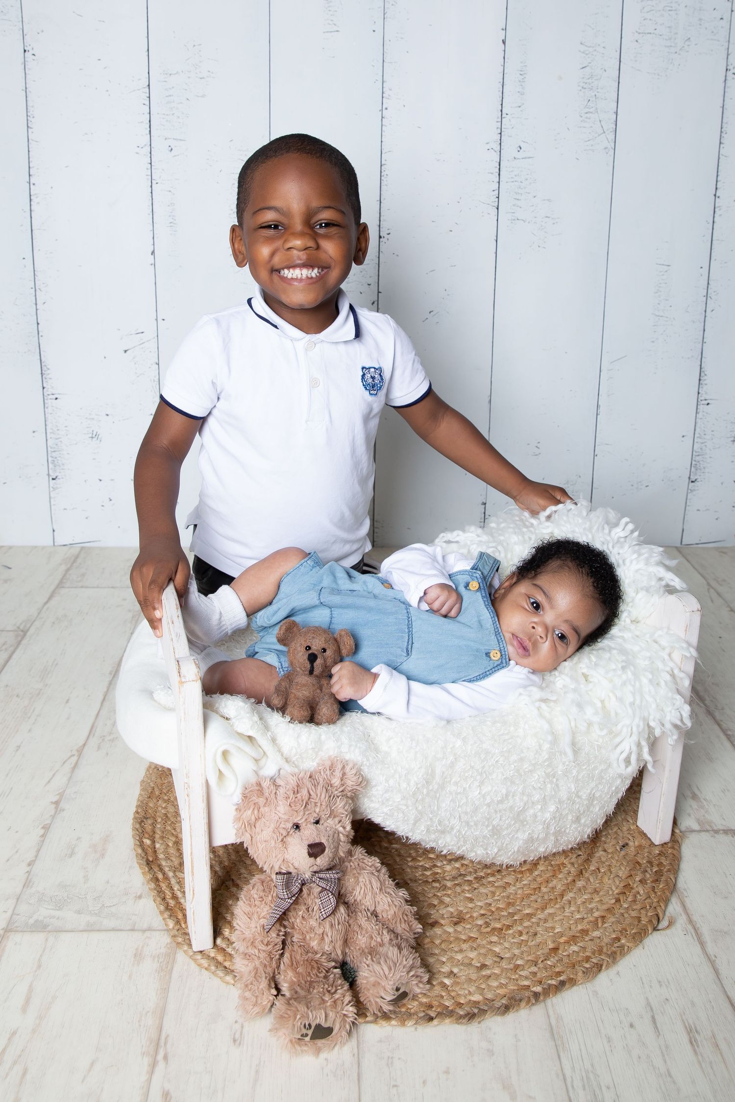 A sweet photo collage showing playful interaction between two children with a teddy bear in a woven basket studio setting.