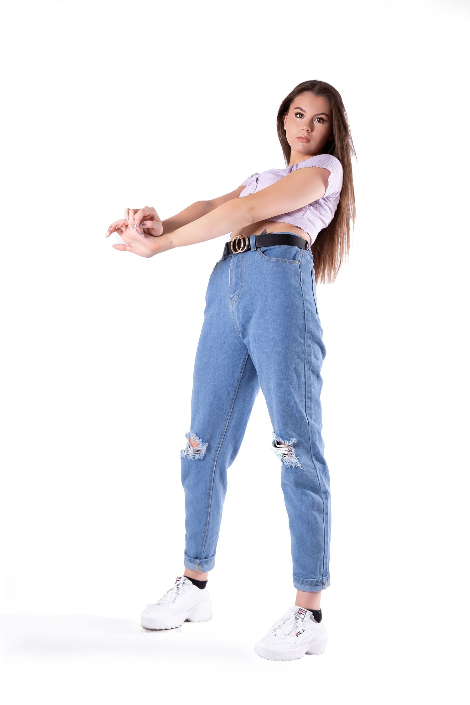 Person in ripped blue jeans and white t-shirt strikes dynamic dance poses against white background.