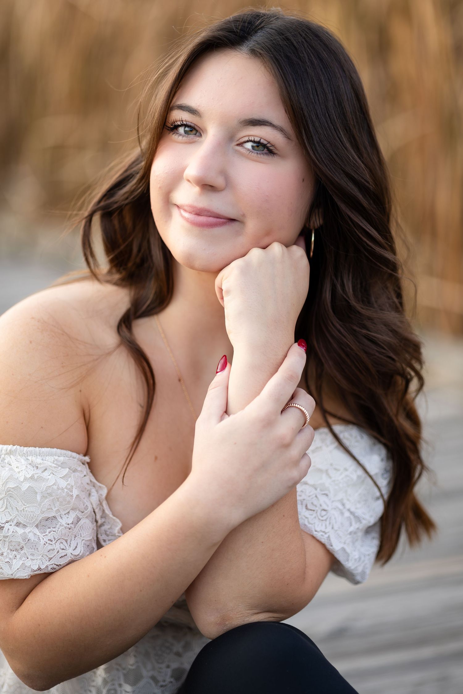 Series of candid expressions in white lace top against natural background.