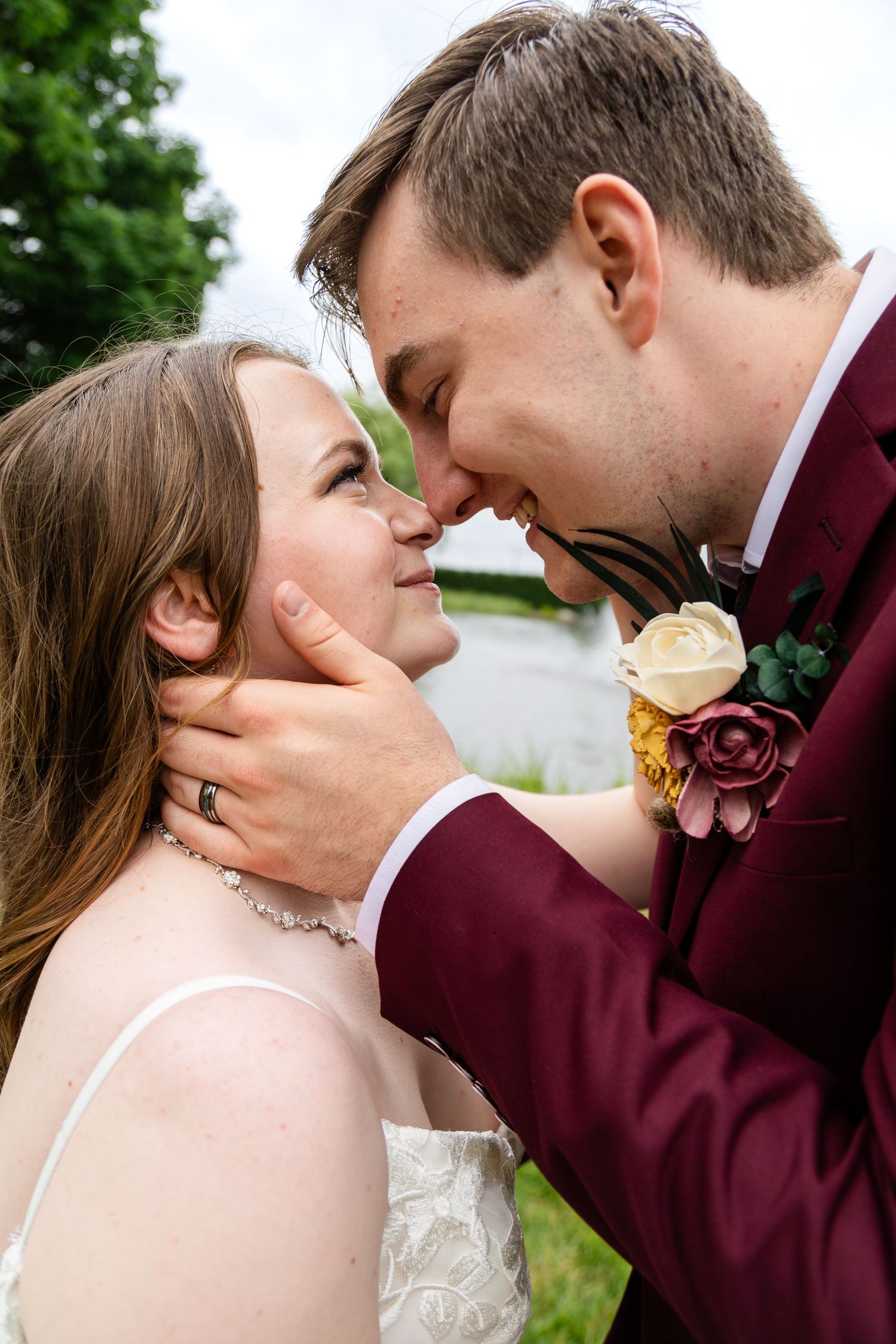 Close-up wedding portraits showing tender moments between newlyweds.