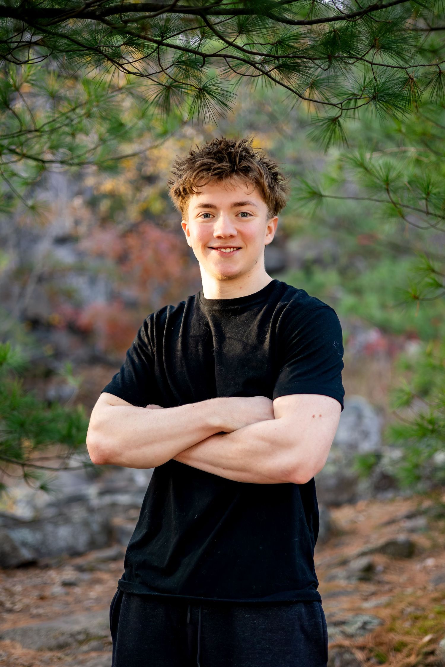 A series of four outdoor portrait photos showing someone in a black t-shirt against a natural forest backdrop.