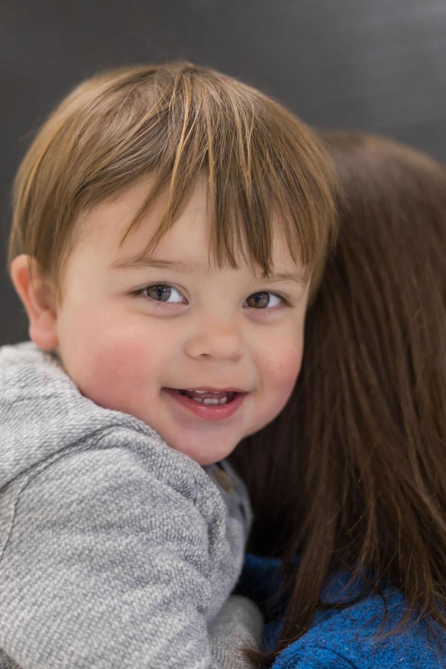 Sweet candid close-up shots showing happy expressions against a dark background.