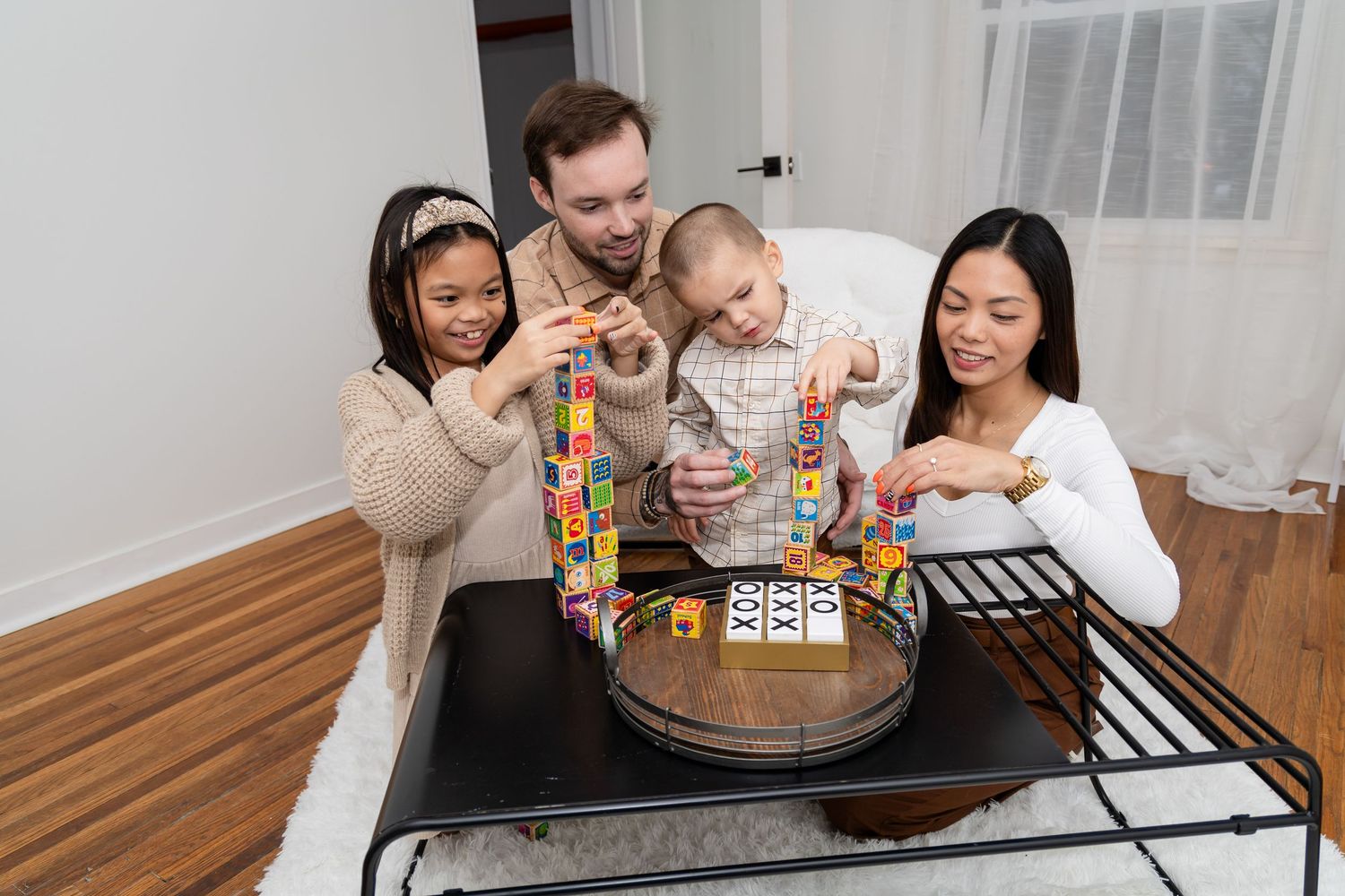 Friends gather around a table playing board games and enjoying each other's company.