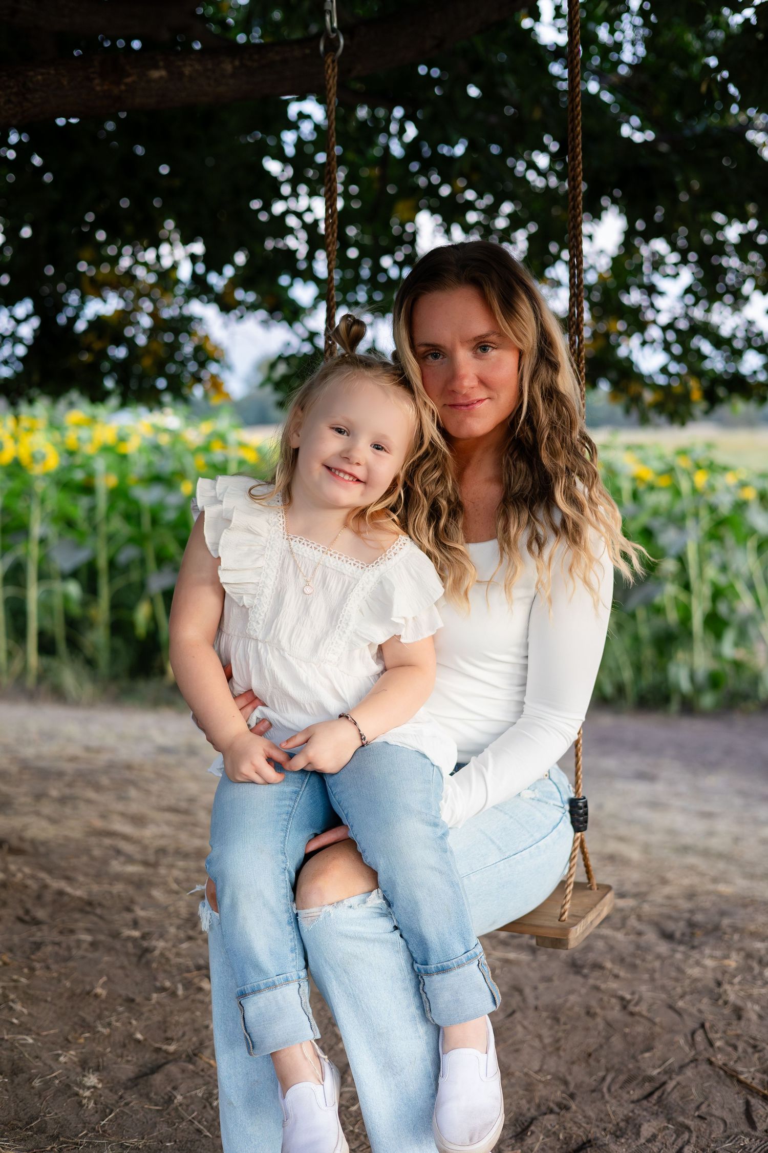 Casual outdoor portrait session in a rustic setting with natural light.