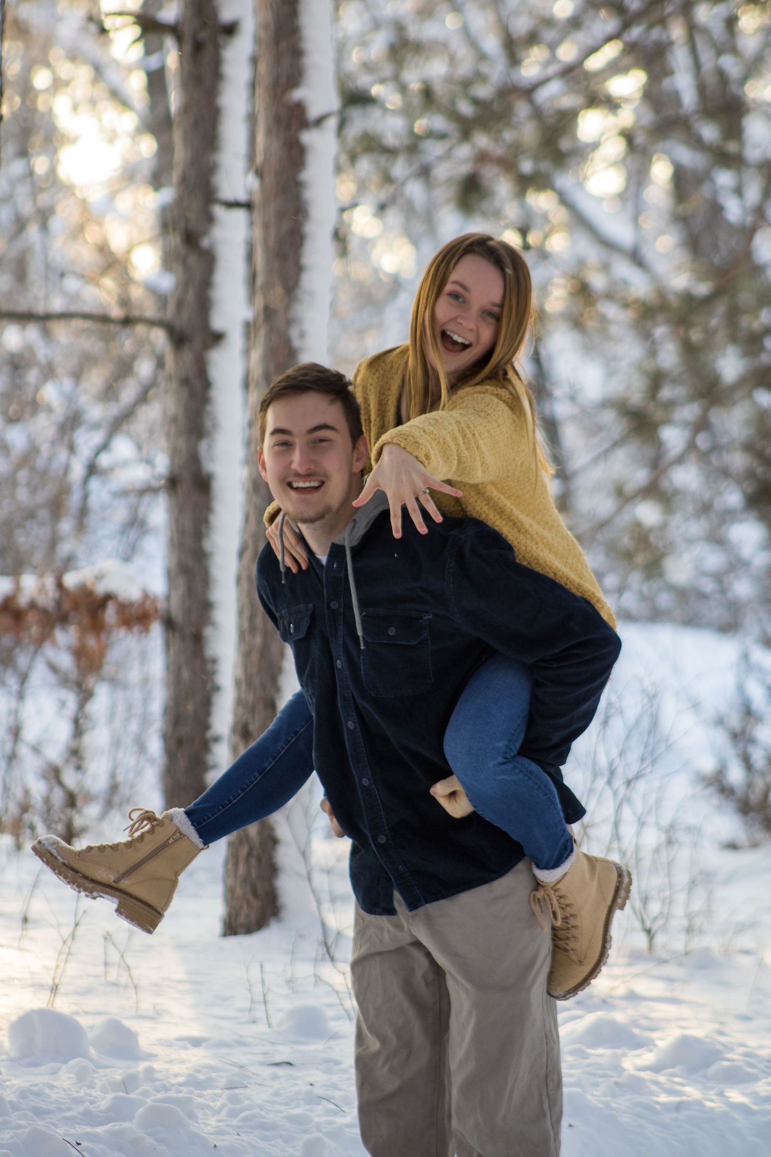 A playful sequence of photos showing a couple embracing in a snowy winter forest setting.