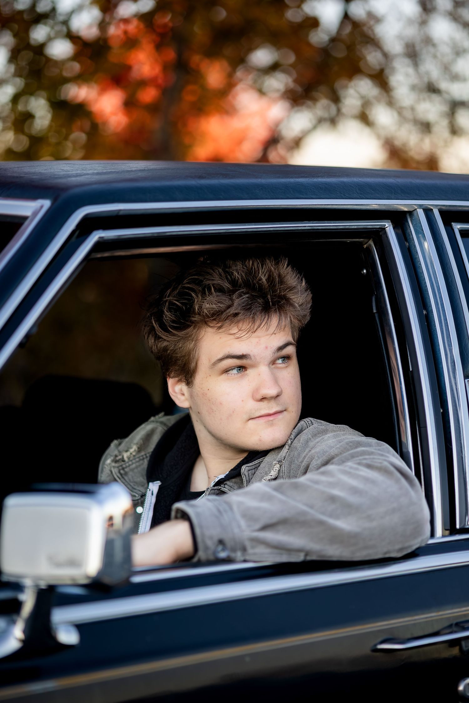 Artistic series of shots through car window showing passenger against autumn trees backdrop.