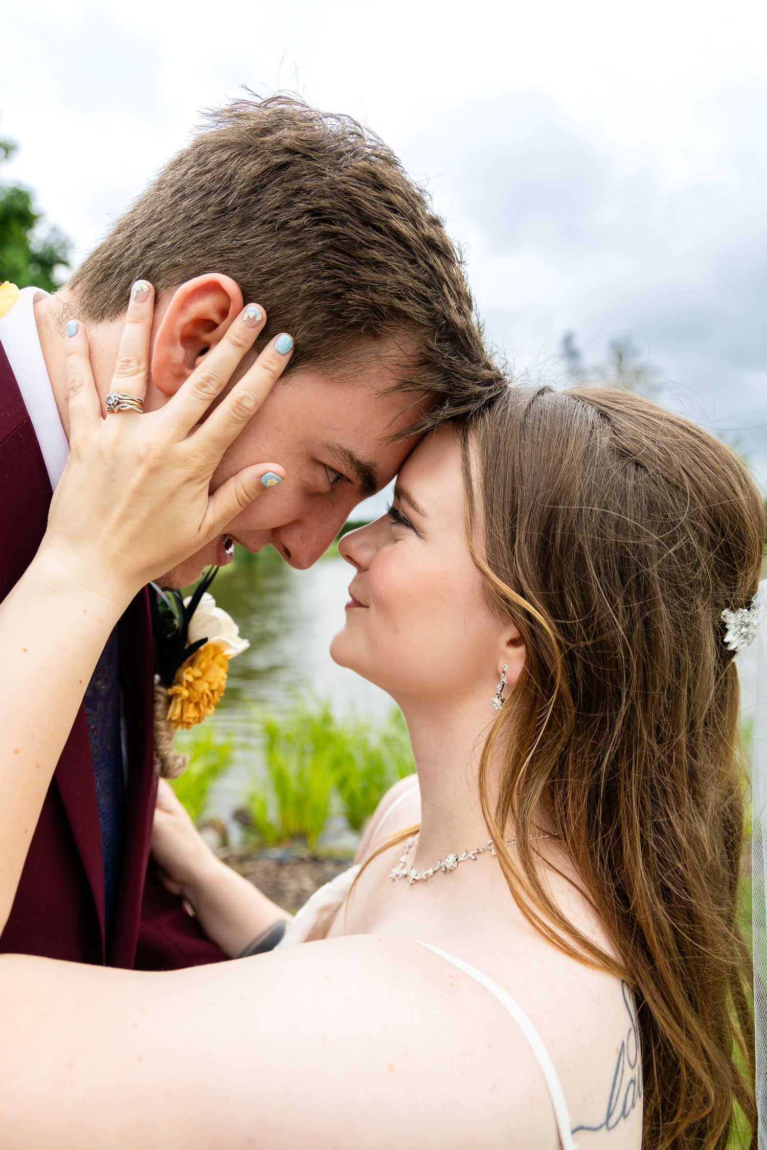 Intimate wedding portraits capturing tender moments between couple outdoors.