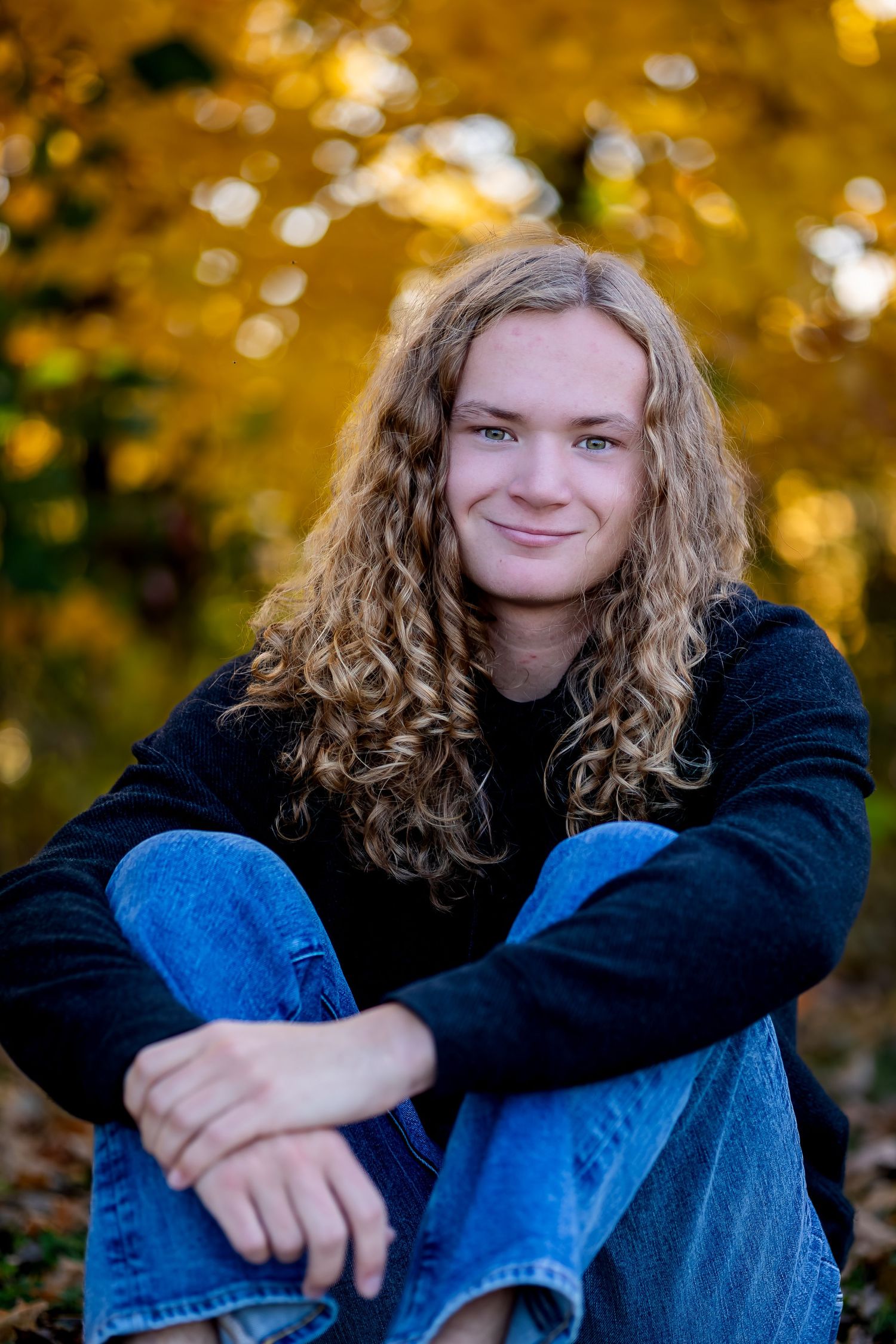 A series of outdoor portrait photos showing someone with long curly hair against a golden autumn background.