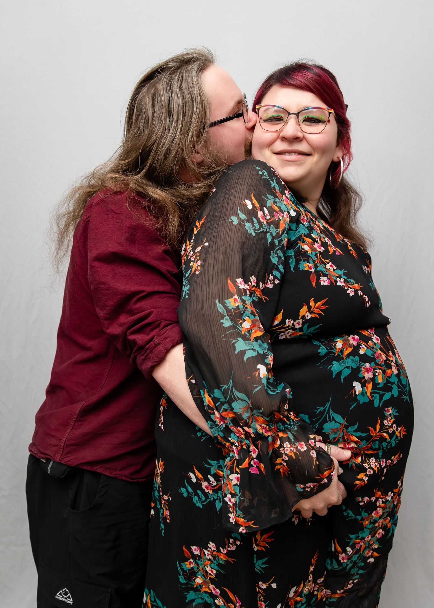 A series of five progressive photos showing a couple in a warm embrace against a light gray background.
