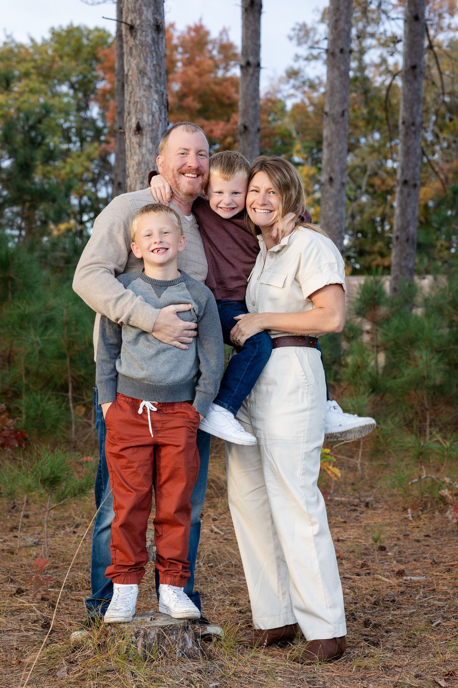 Candid family moment captured outdoors with everyone laughing together.
