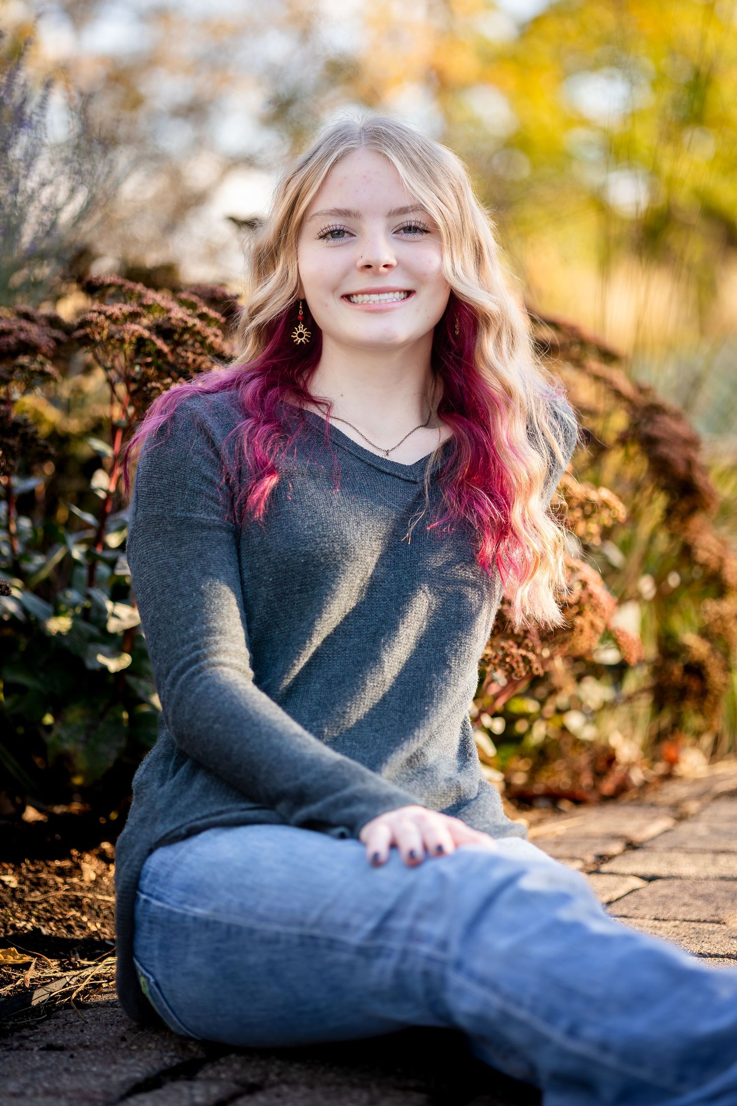 Portrait photos in autumn setting with colorful foliage and natural lighting showing casual outdoor style.