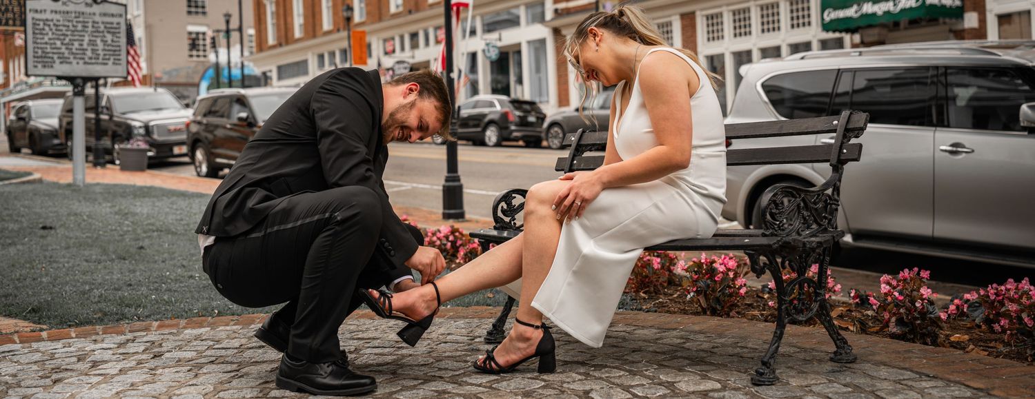 Urban wedding photography session with couple on brick-lined street.