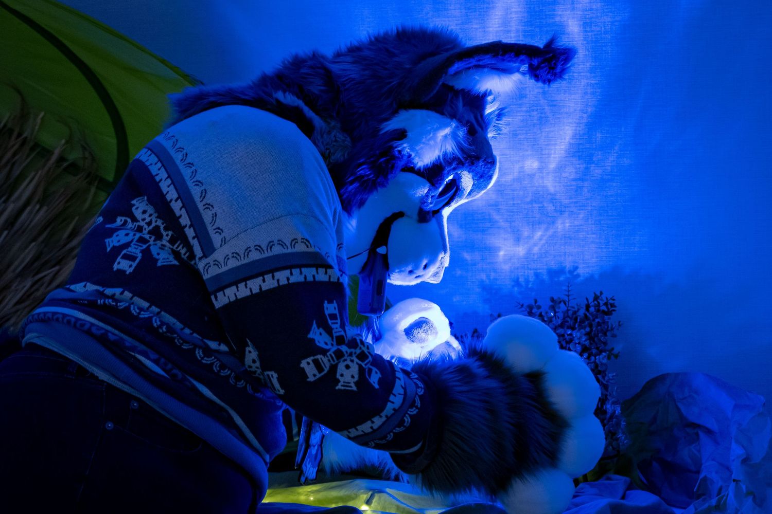 Blue LED lights create a dramatic illuminated effect in a dark room setting.