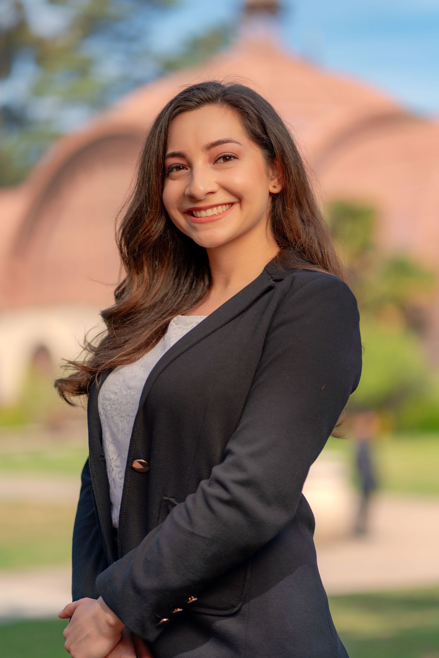 Professional portrait series of a person in business attire smiling against an outdoor background.