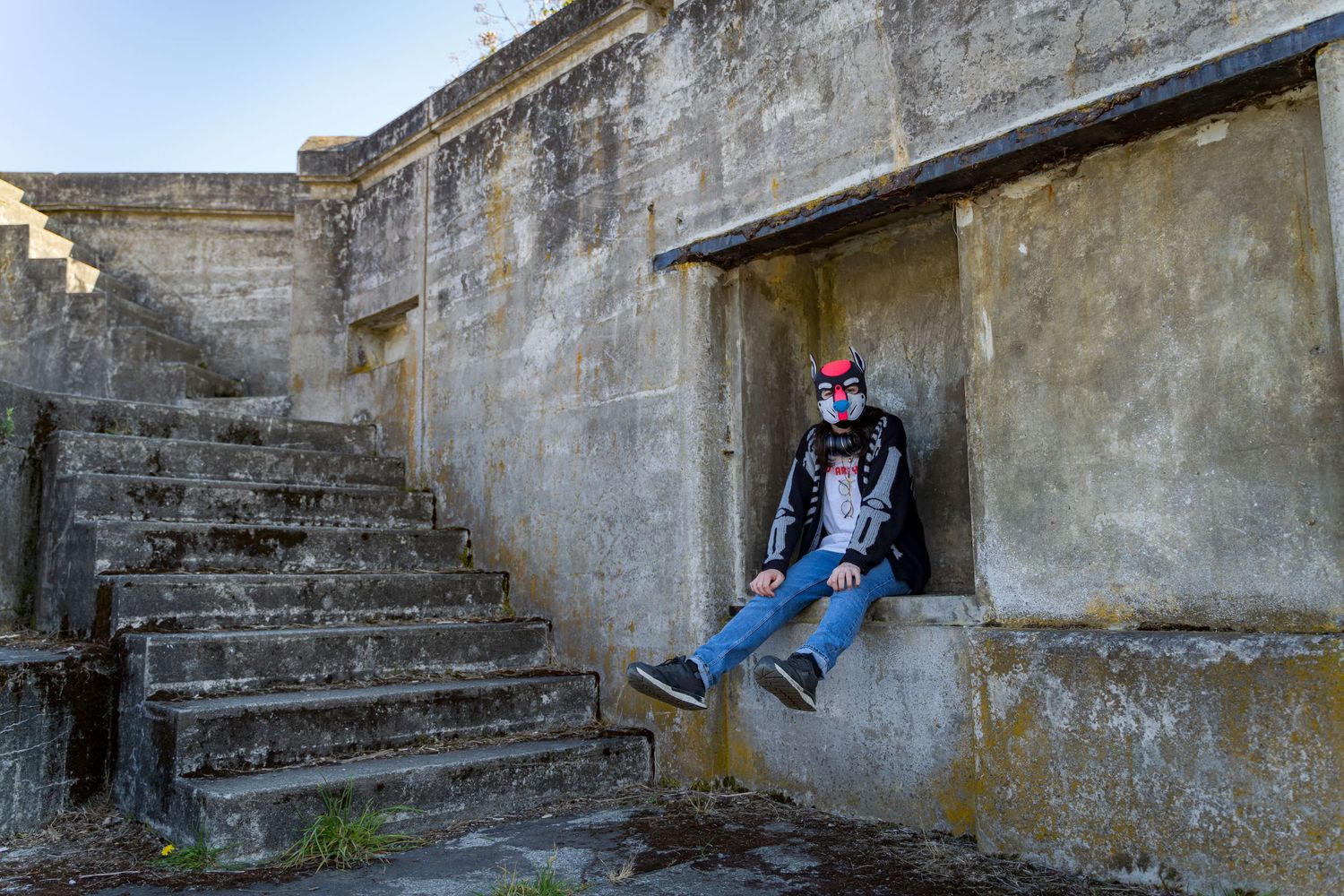 Military bunker exterior with weathered concrete walls and stairs.