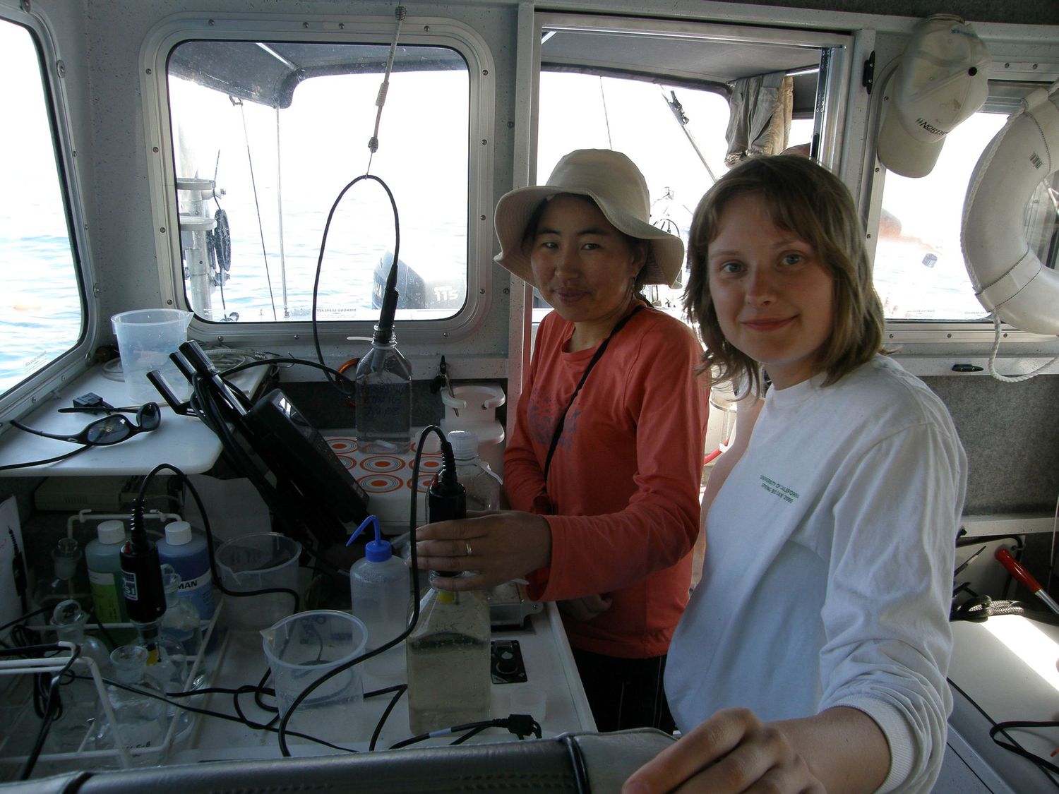 Interior view of a boat cabin showing navigation equipment and controls.
