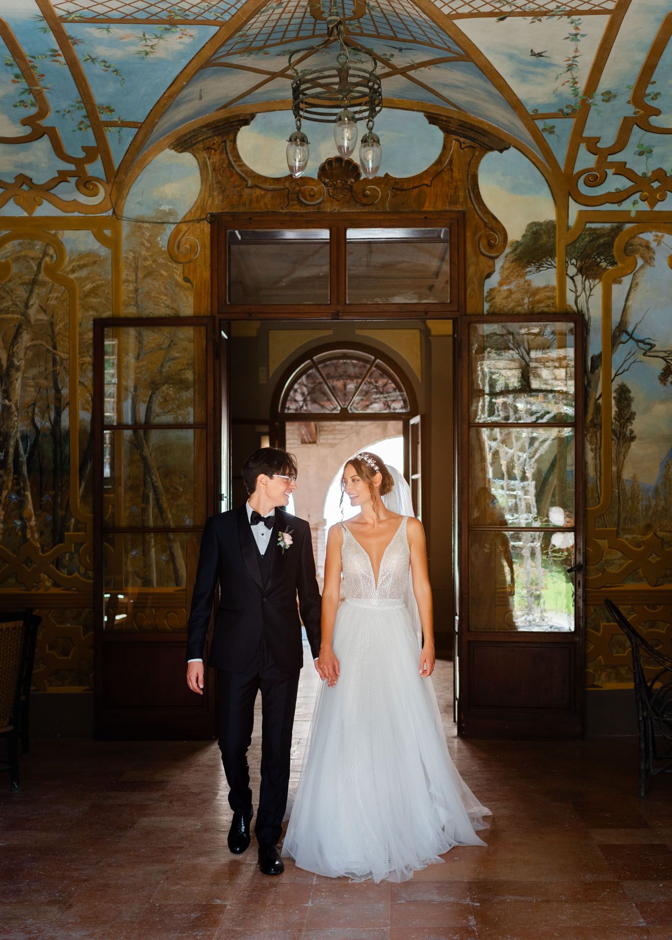 Elegant wedding portrait inside a frescoed Italian villa in Le Marche