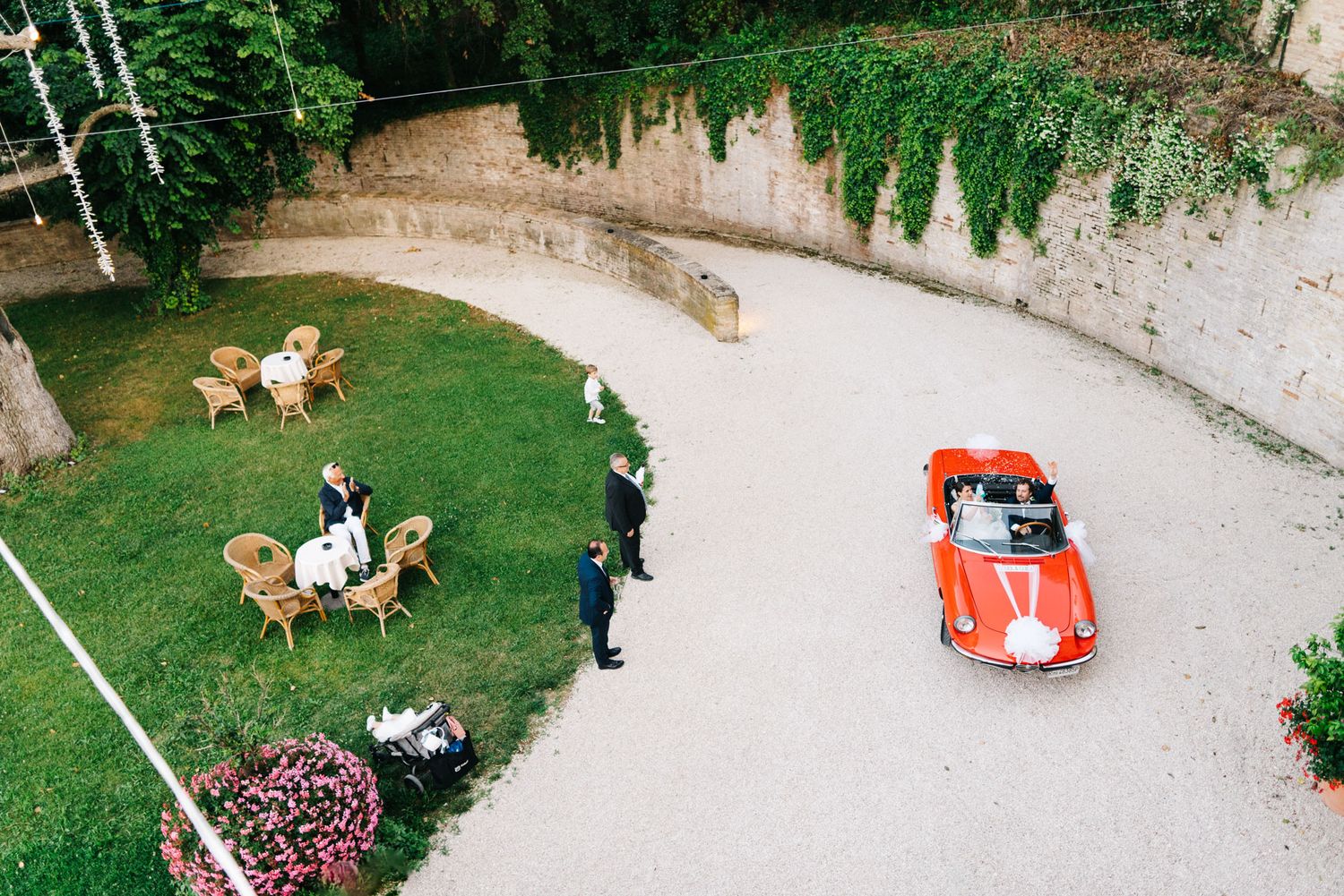 Wedding arrival in a charming Italian piazza in Le Marche during a destination wedding celebration