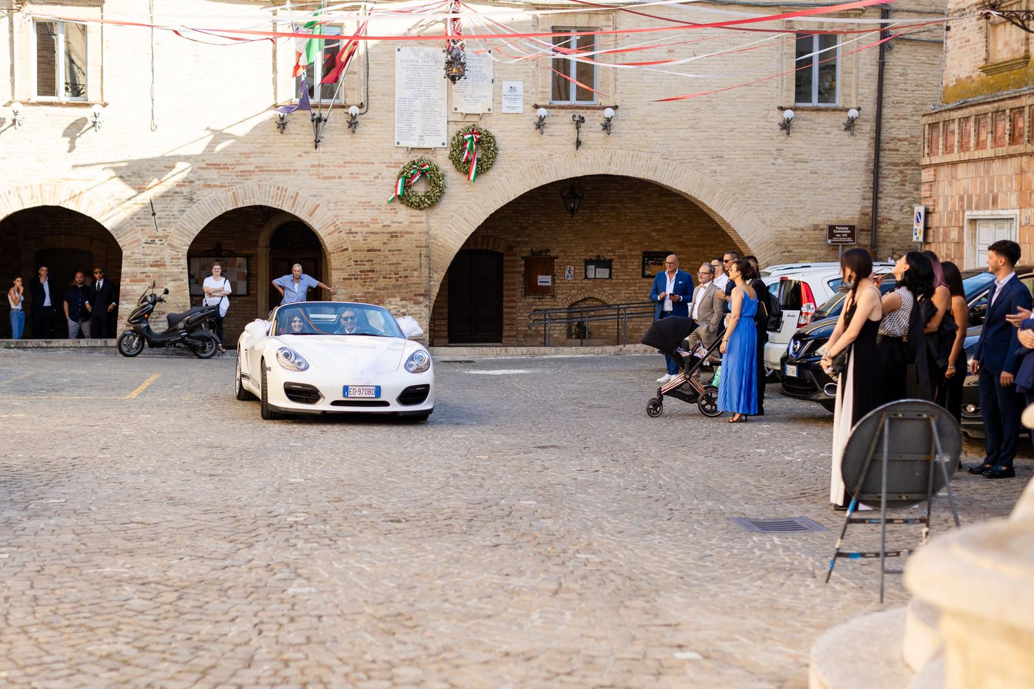 Bride and groom in a romantic courtyard in Le Marche, Italy during an intimate countryside wedding