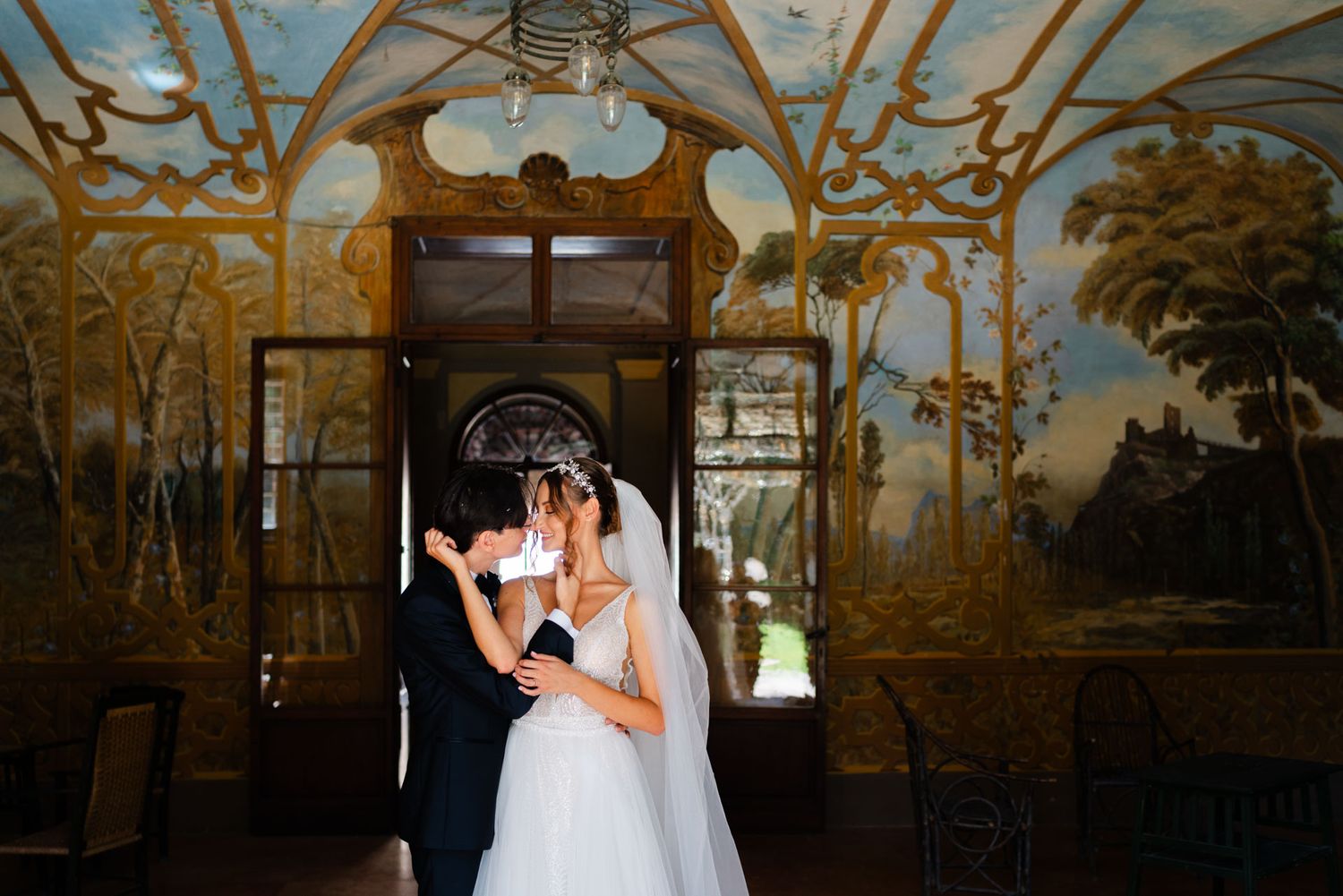 Elegant wedding portrait inside a frescoed Italian villa in Le Marche