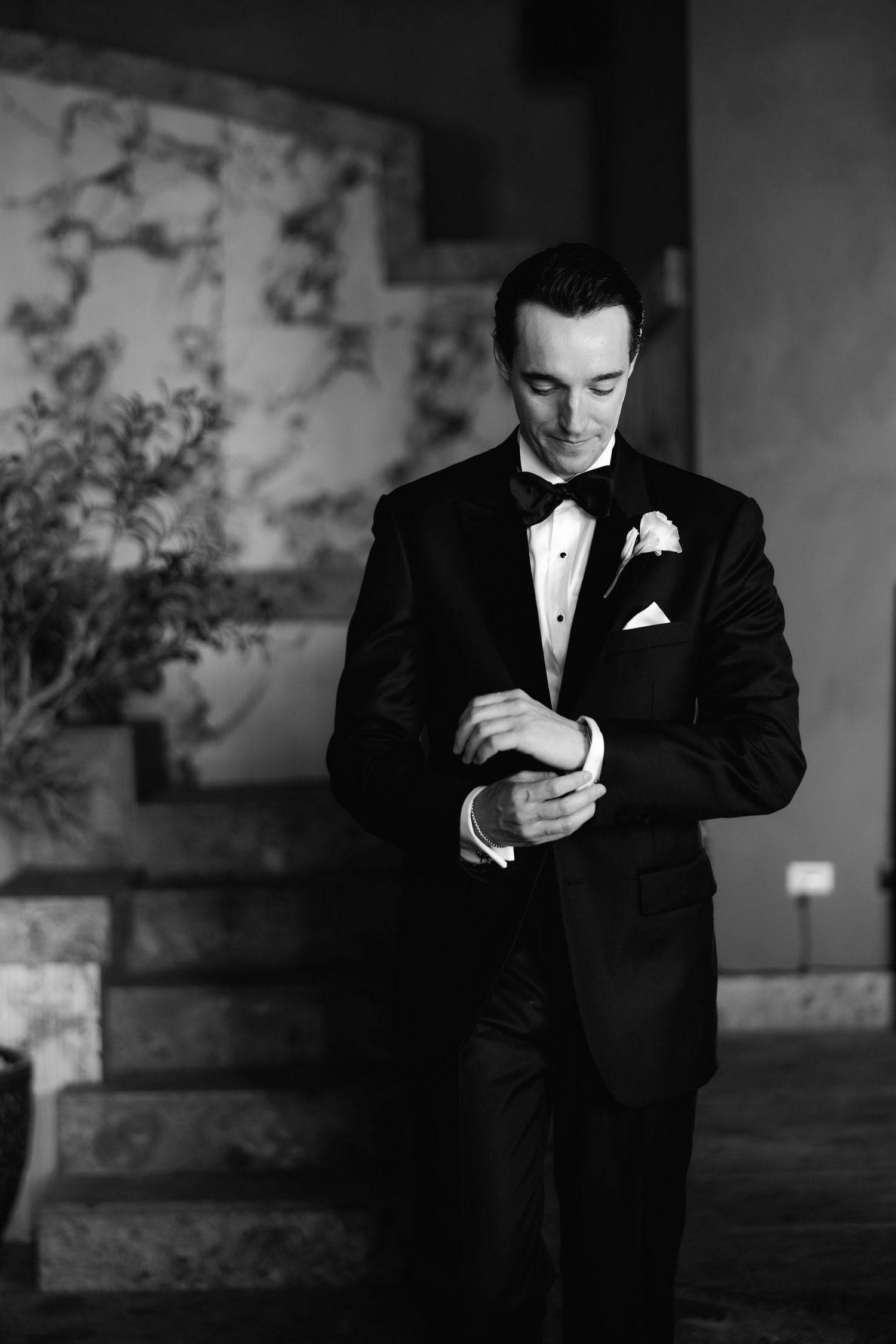 A monochromatic series of elegant formal portraits in a dimly lit sophisticated venue space.