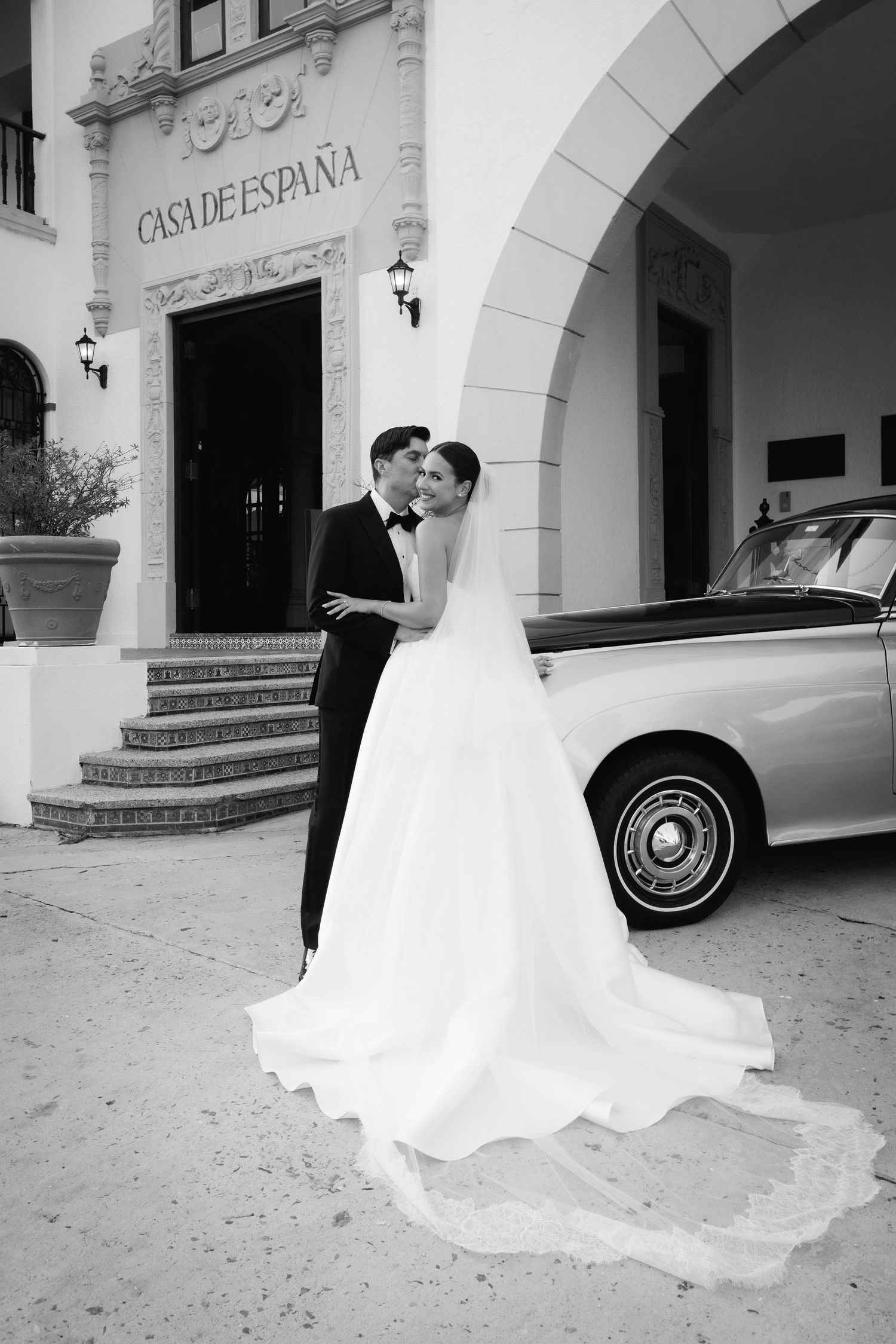 A series of romantic wedding photos showing a couple in front of Casa de Espana with a classic car in black and white.