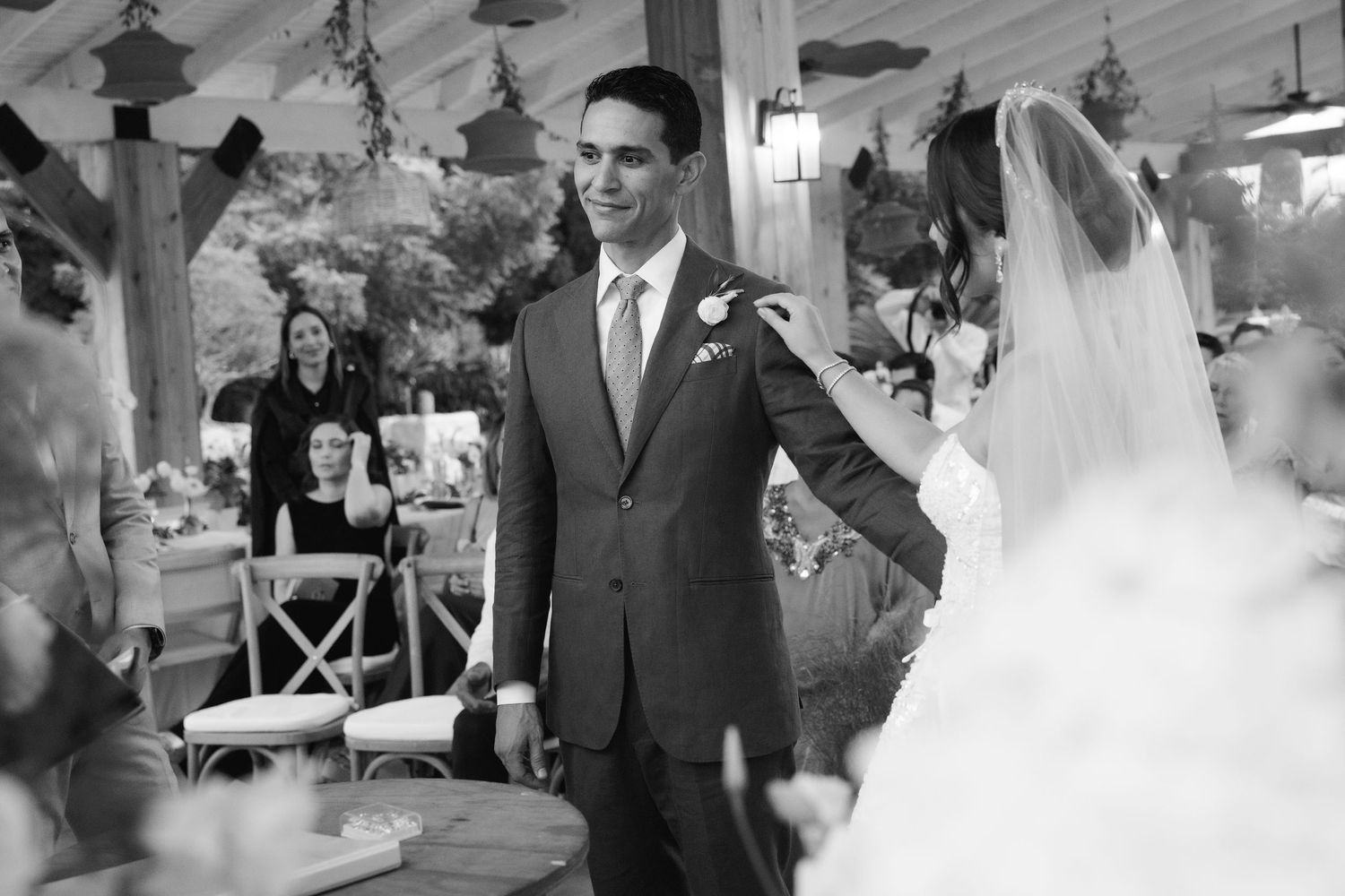 A collection of black and white wedding photographs showing romantic moments and celebrations at a vintage ceremony.