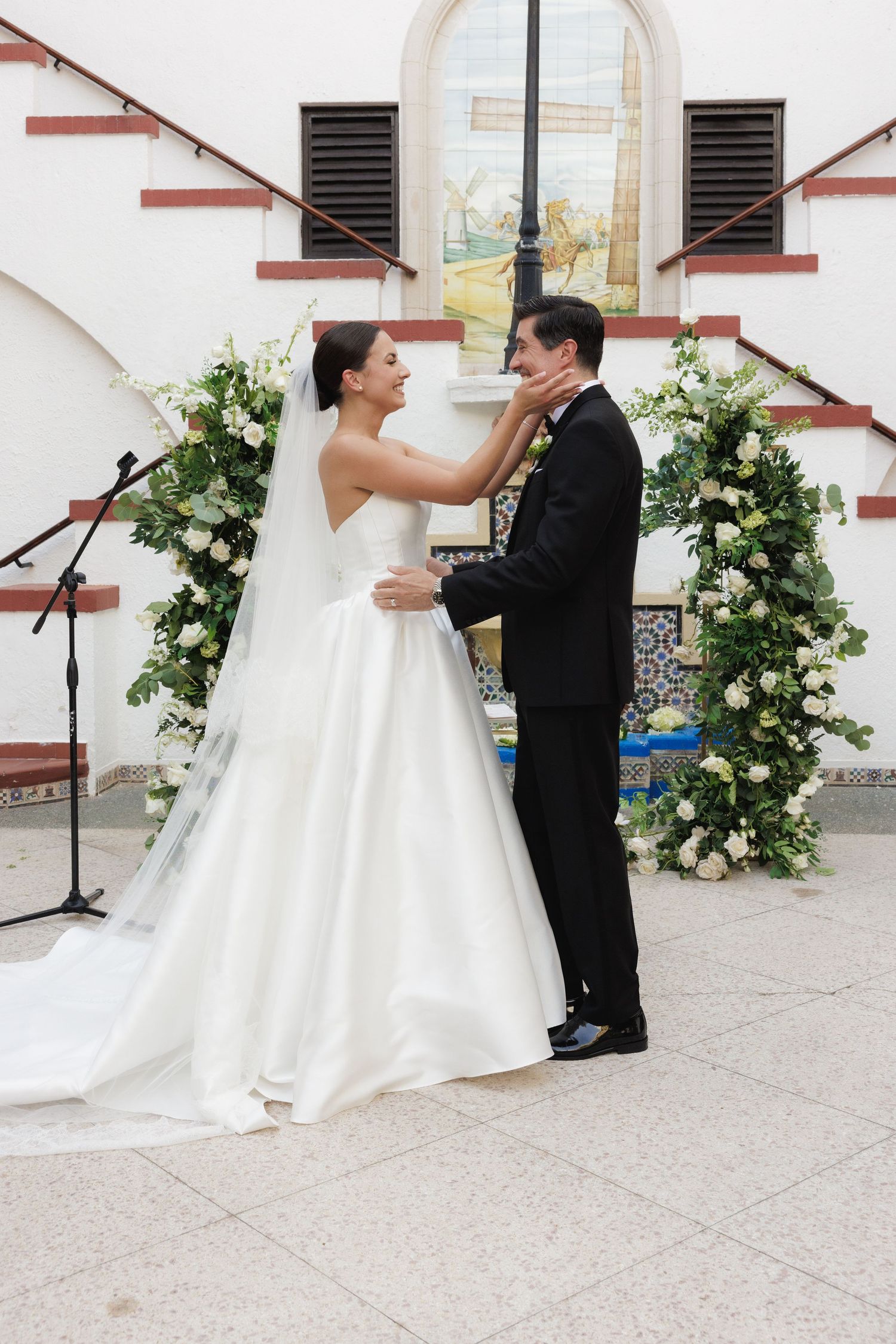 Candid wedding photo series capturing bride and groom dancing together on outdoor patio.