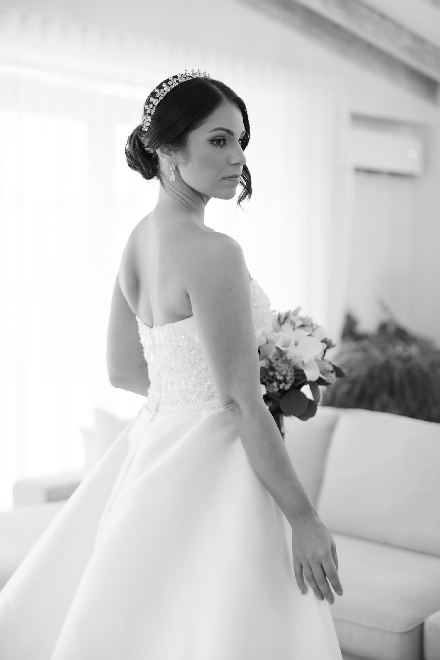 Artistic black and white shots of a bride in a ballgown wedding dress.