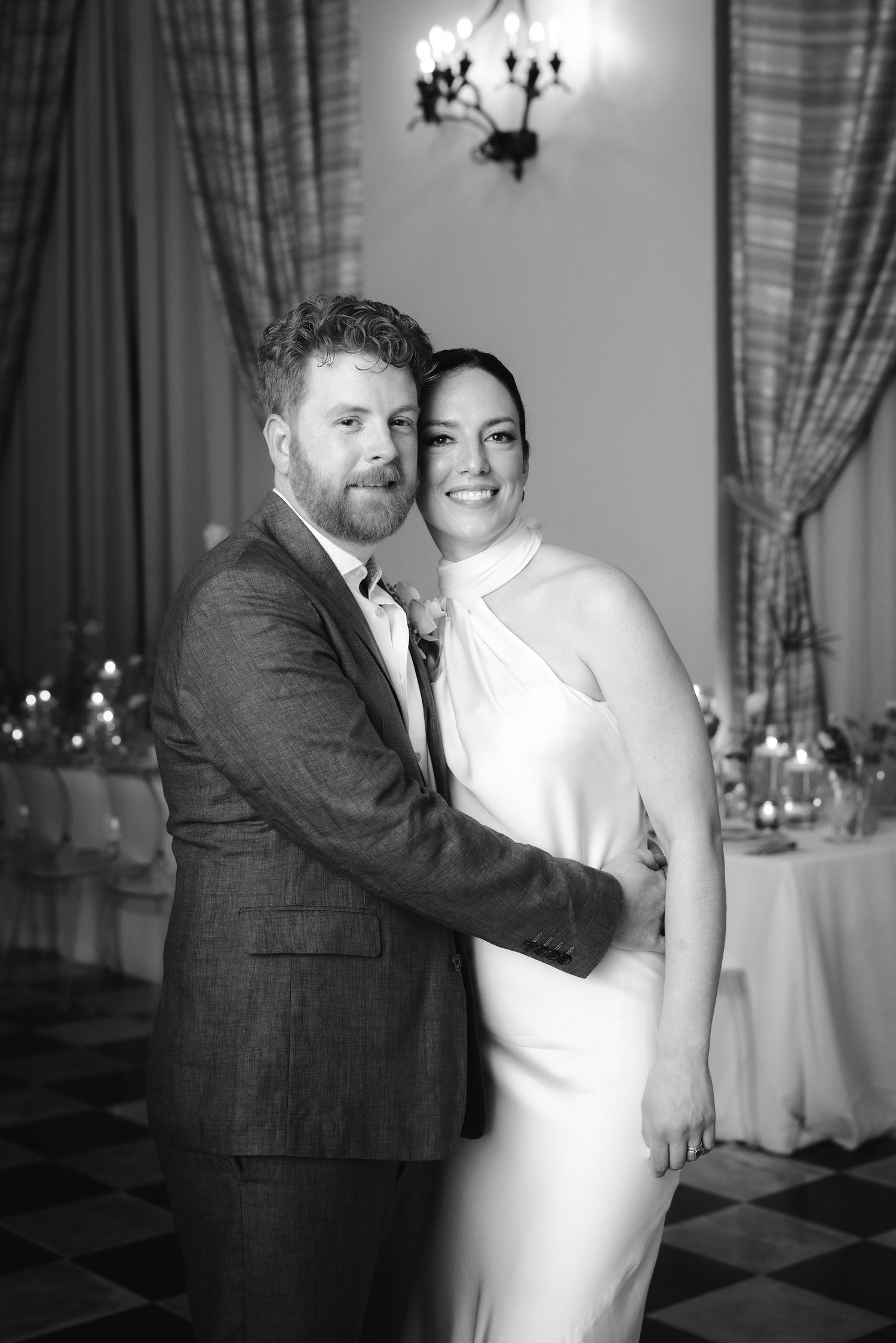 A sequence of romantic black and white candid dance photos from a wedding reception.