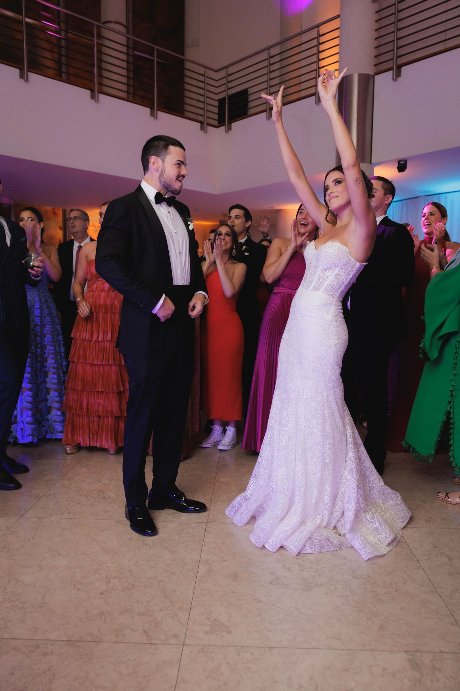 A compilation of dancing moments at a wedding reception with a bride in white gown celebrating on a light colored dance floor.