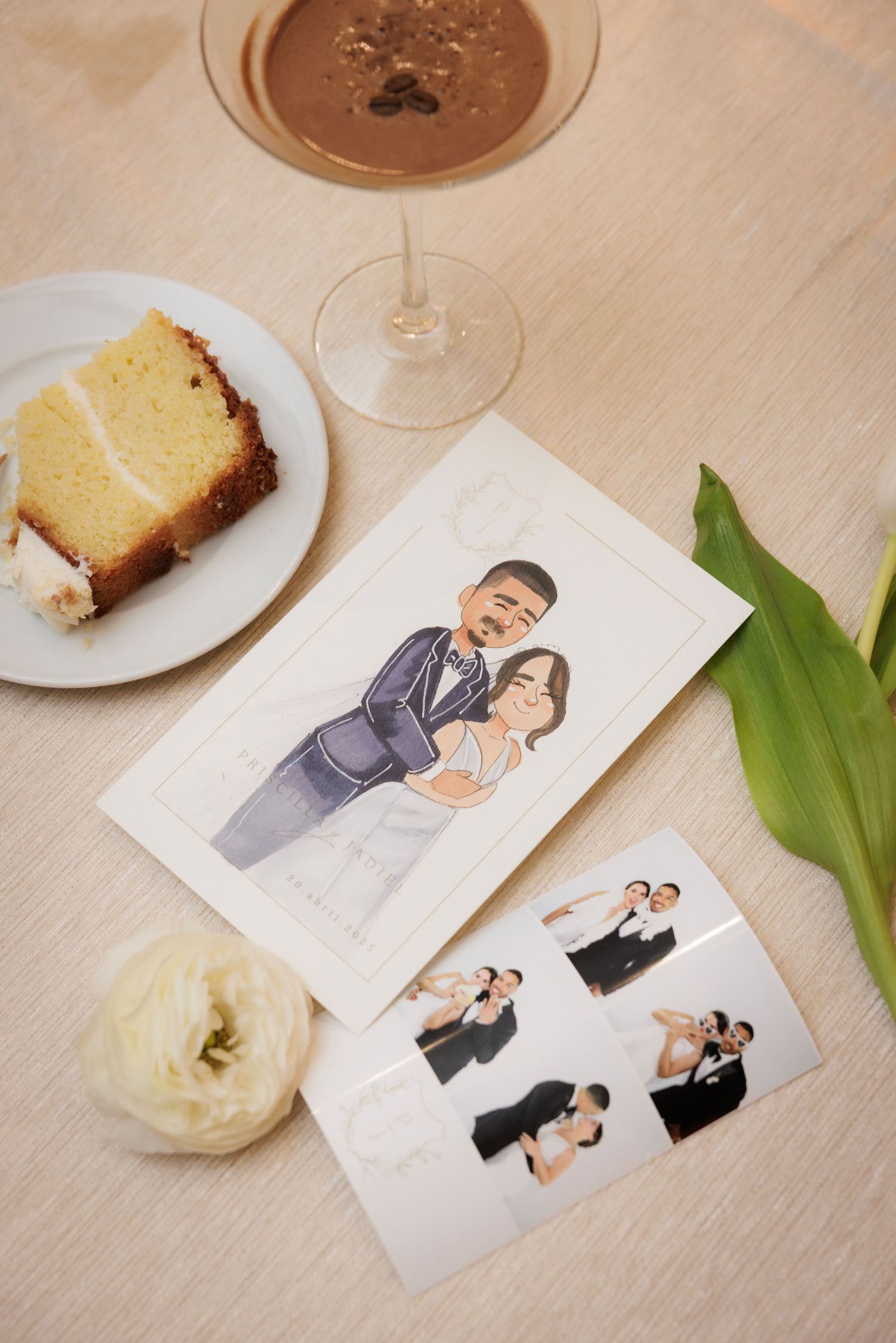 Illustrations and photos displayed alongside a slice of pound cake, glass of chocolate drink, and white flower on wooden table.