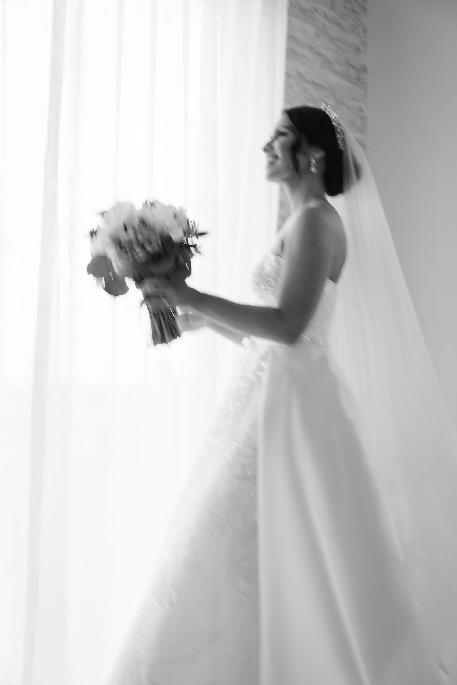 Ethereal black and white series showing flowing movement in a wedding dress.