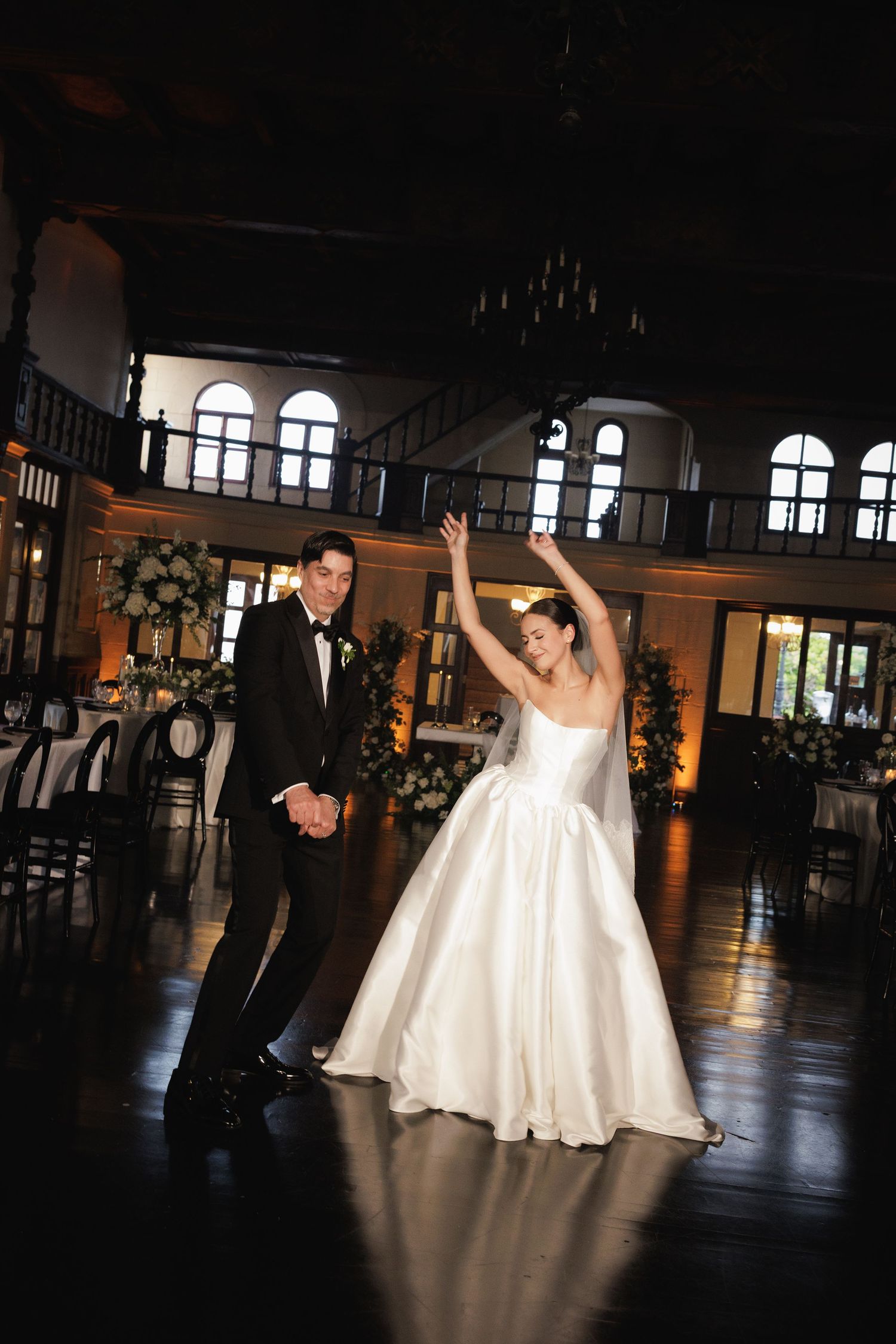 A sequence of dance floor moments at a wedding reception with dramatic lighting and silhouettes.