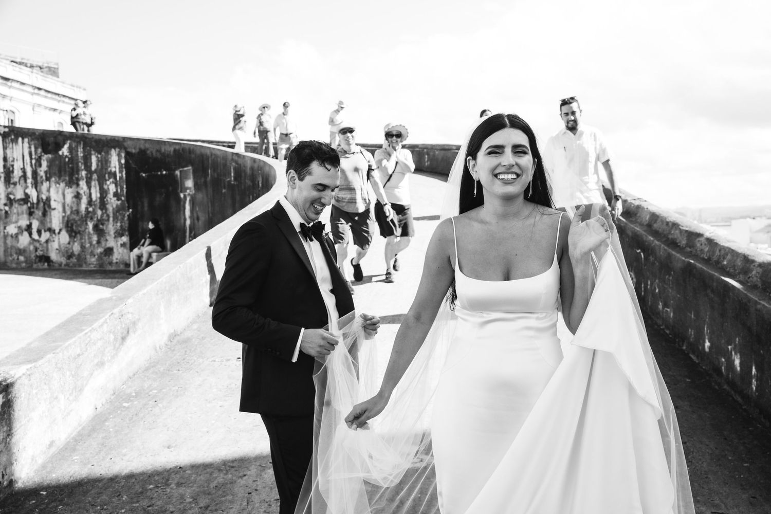 Black and white photo series of wedding celebration moments outdoors.