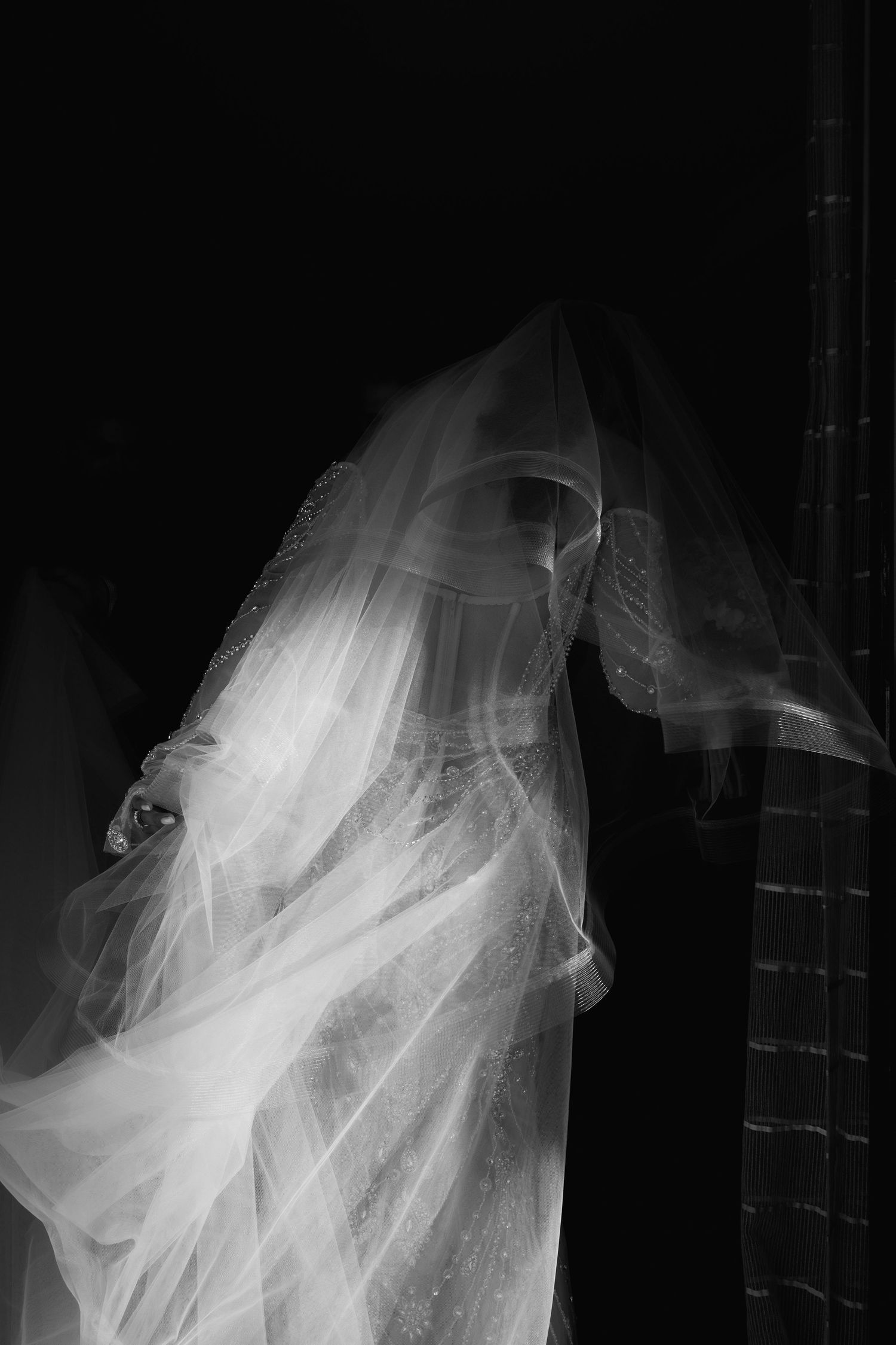 Multiple abstract close-up shots of flowing white wedding dress tulle and fabric details.