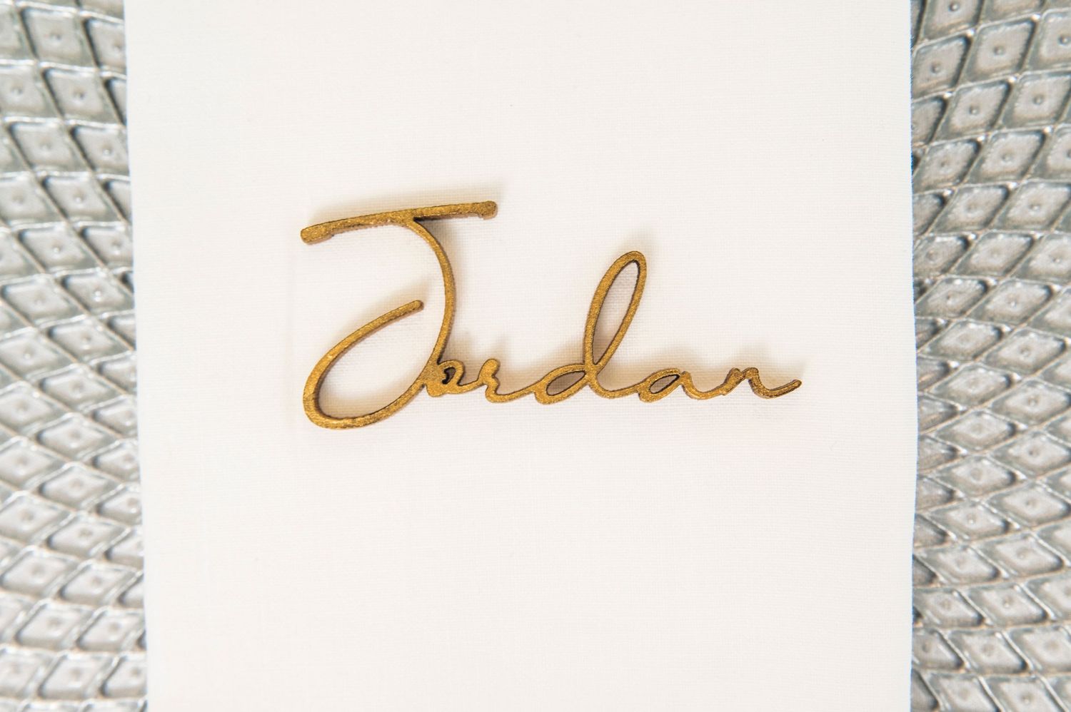 A set of decorative frames and text elements in golden tones arranged against a light background.