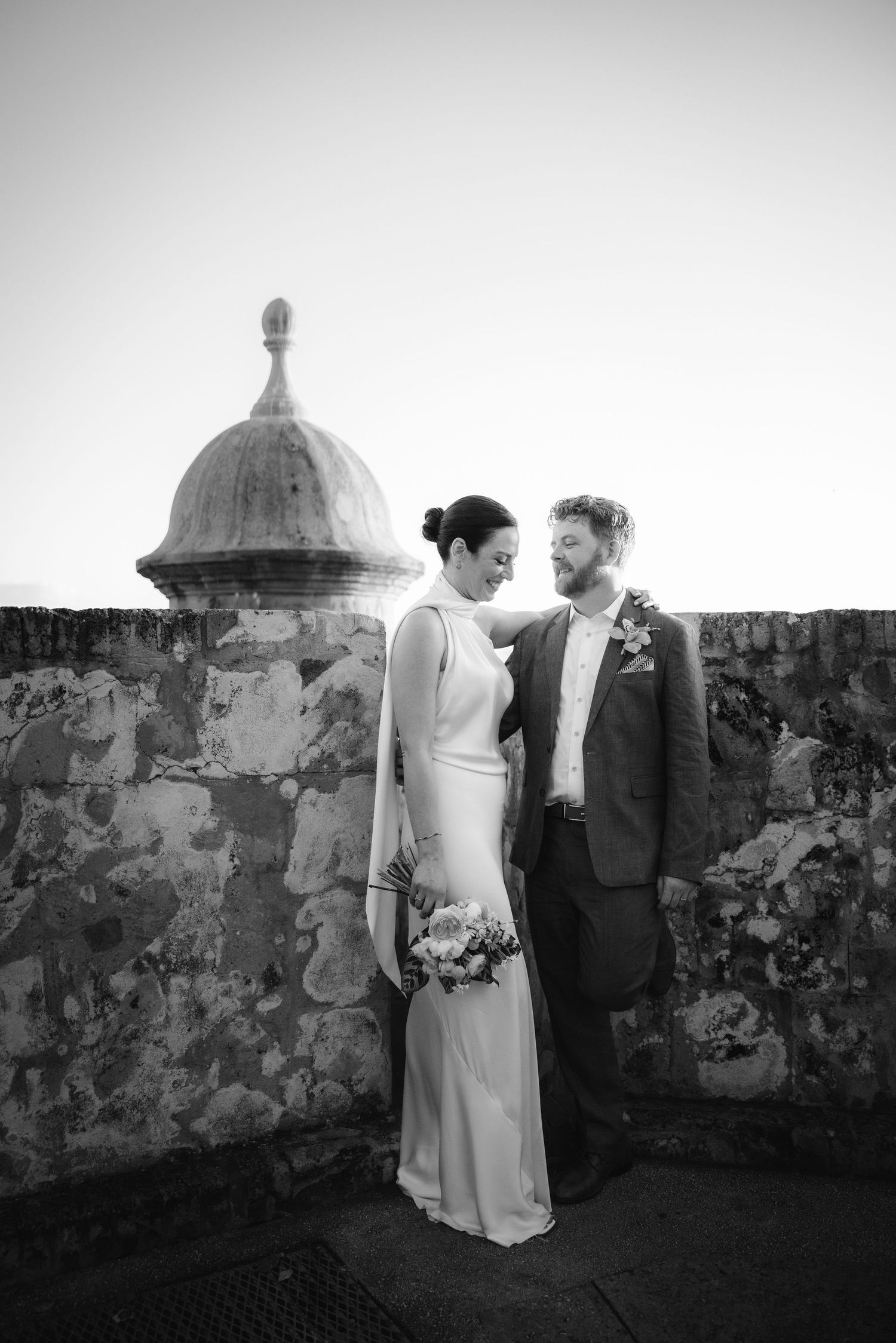 A black and white photo on historic stone ramparts with domed architectural features.