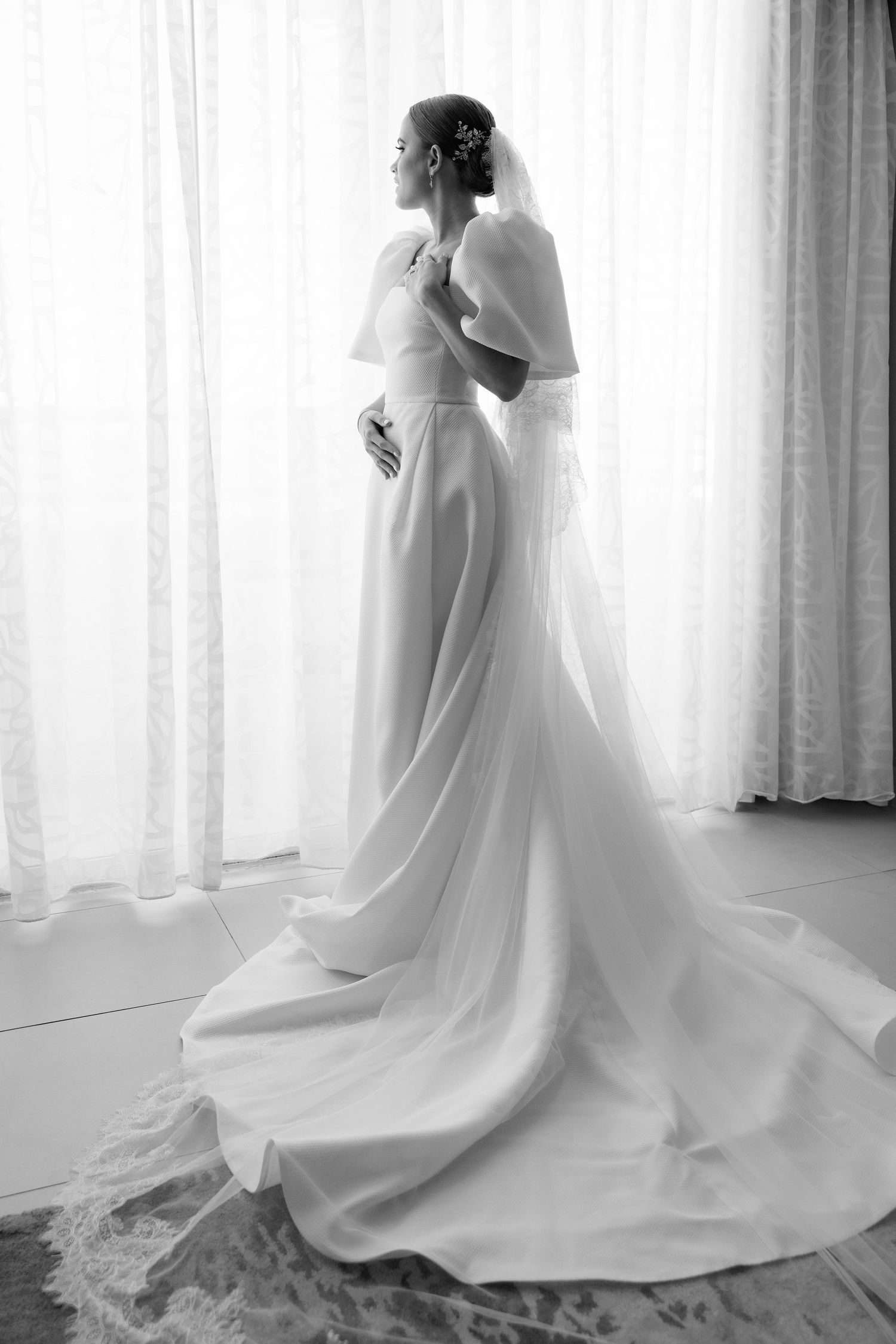 A series of bridal portraits showcasing the elegant flow of a white wedding dress with a long train.