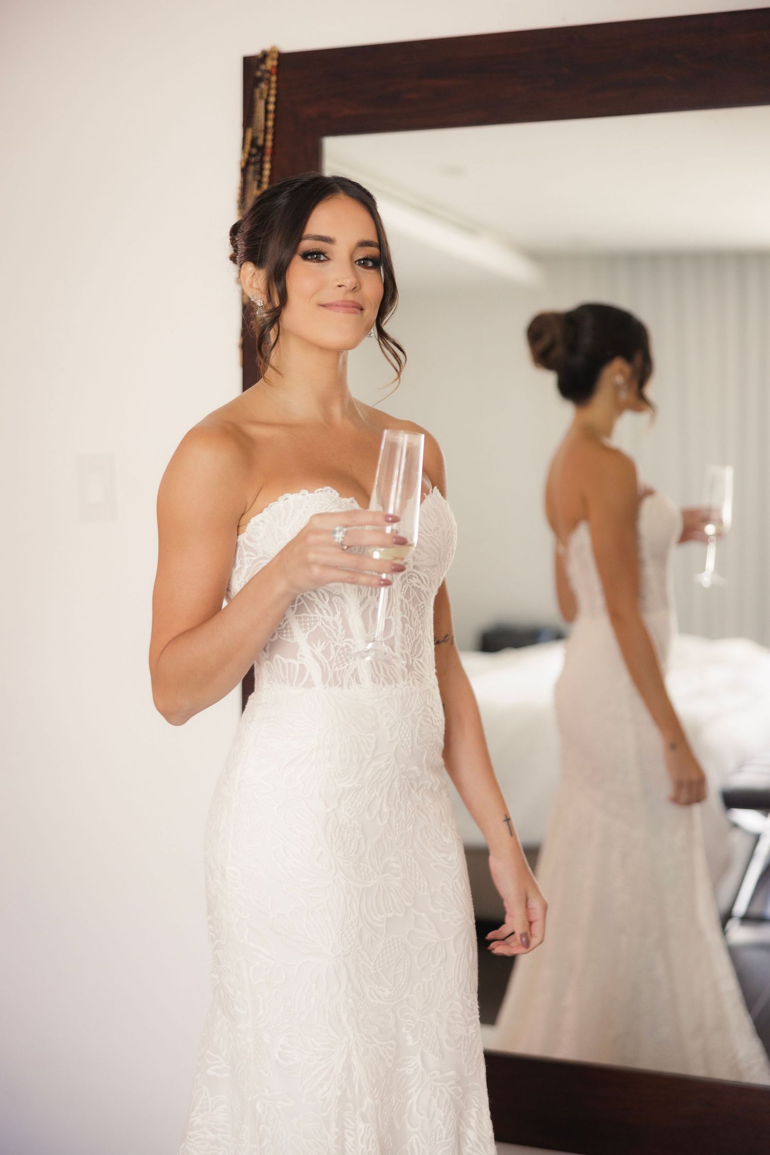 A white wedding dress is displayed in multiple detail shots showing delicate lace and beading details.