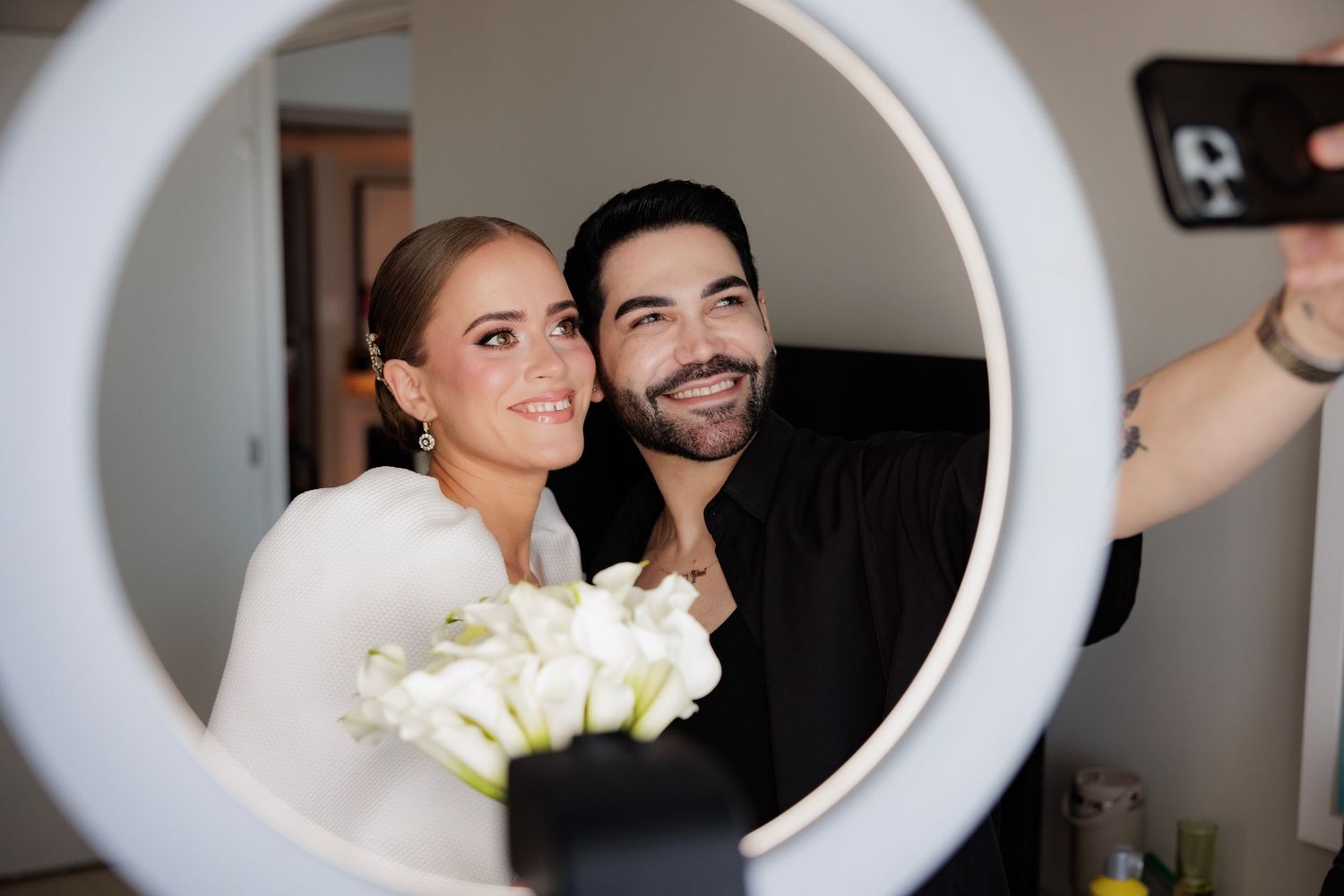 A couple poses joyfully through large circular frames in a series of connected wedding photos.