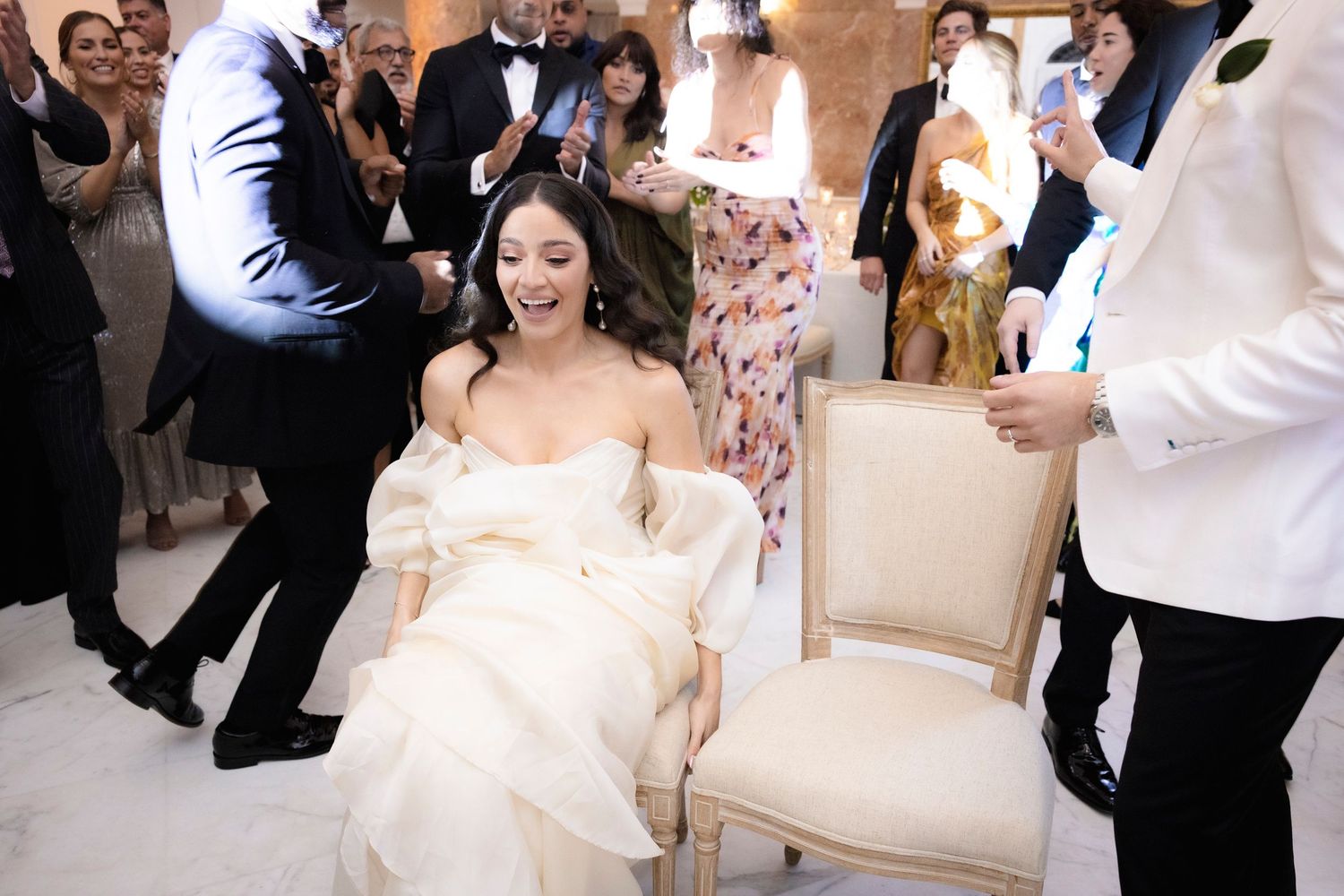Wedding reception celebration with dancers in formal attire.