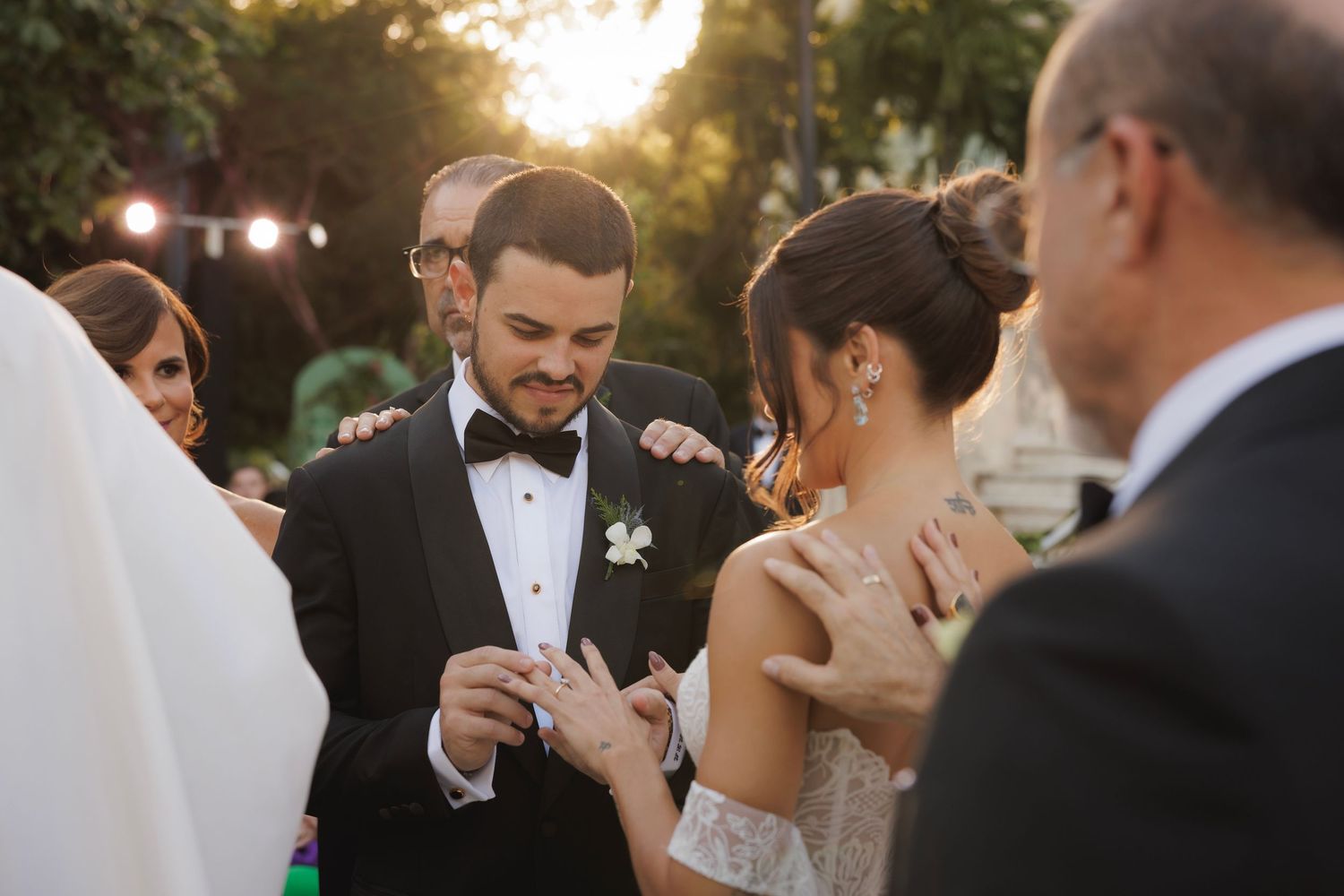 Intimate outdoor wedding ceremony moment at golden hour.