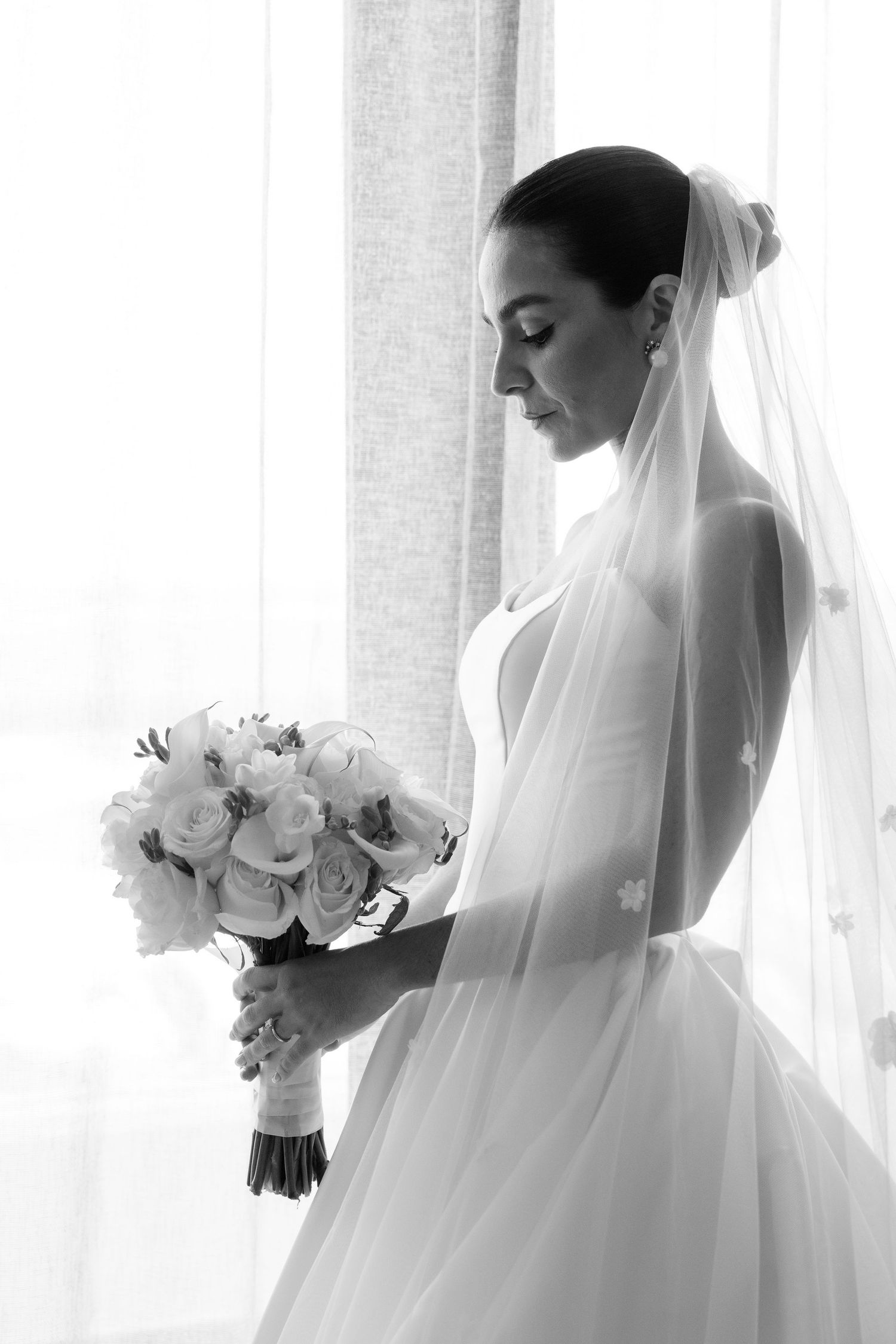 A series of ethereal bridal portraits in white showing a bride in a flowing veil holding a white rose bouquet.
