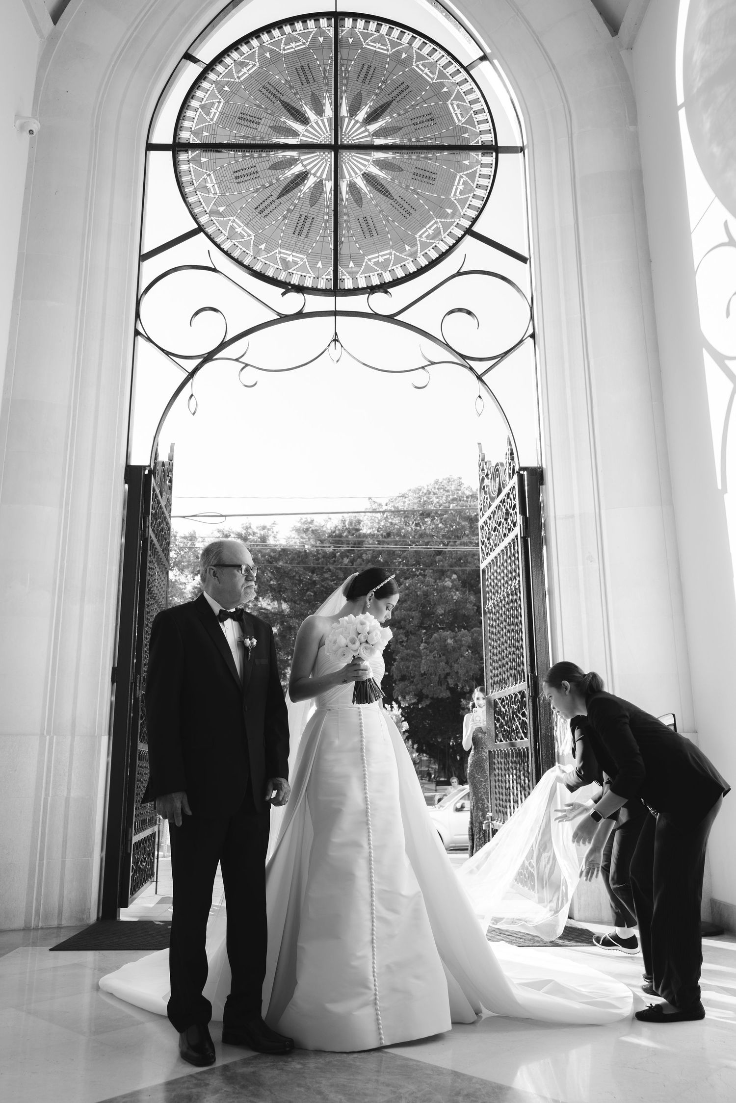 Black and white wedding photography series showing couple and officiant in elegant white archway during ceremony.