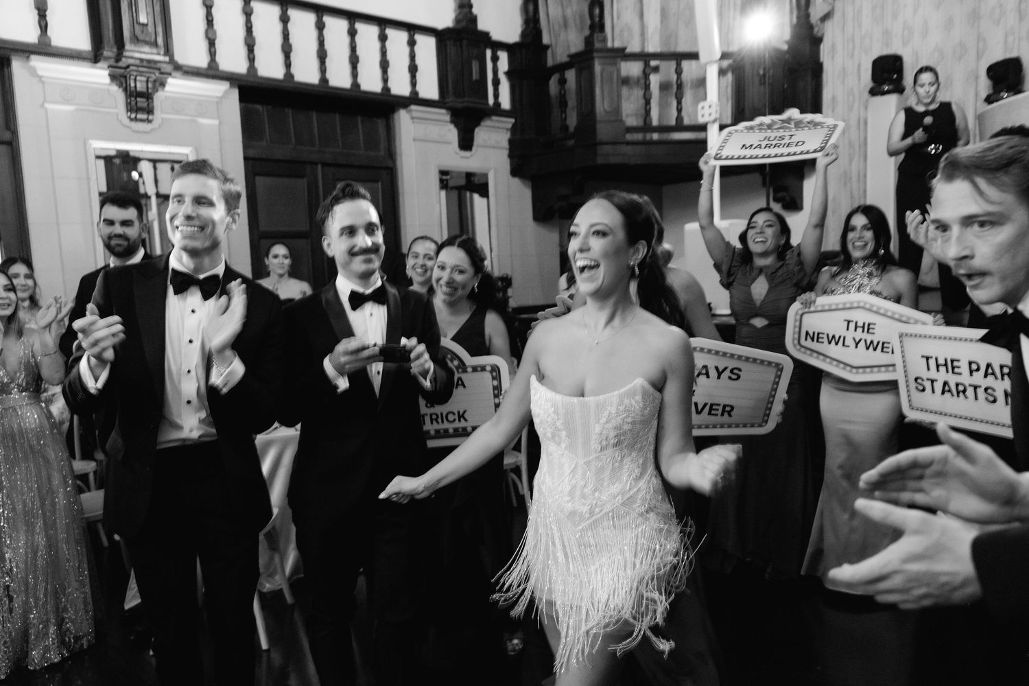 Black and white wedding photos capture joyful moments and dancing during a reception celebration.